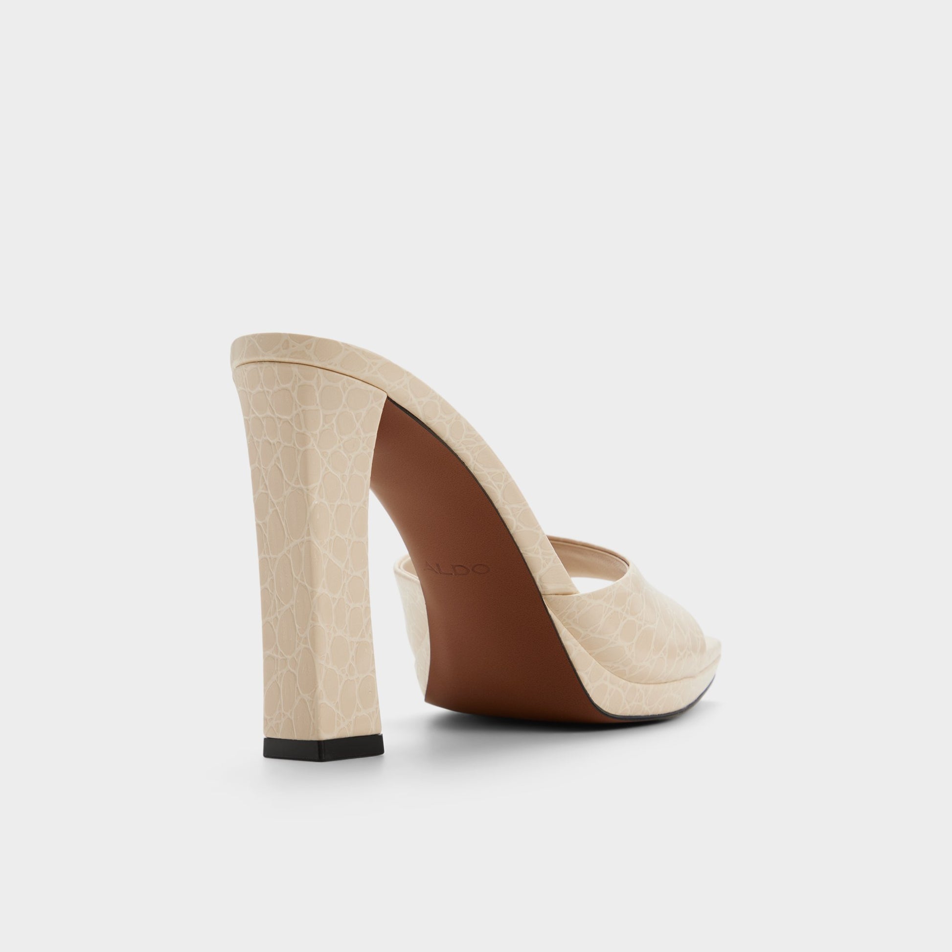 Three-quarter angle of Cream Biscuiit Heeled mule's back side