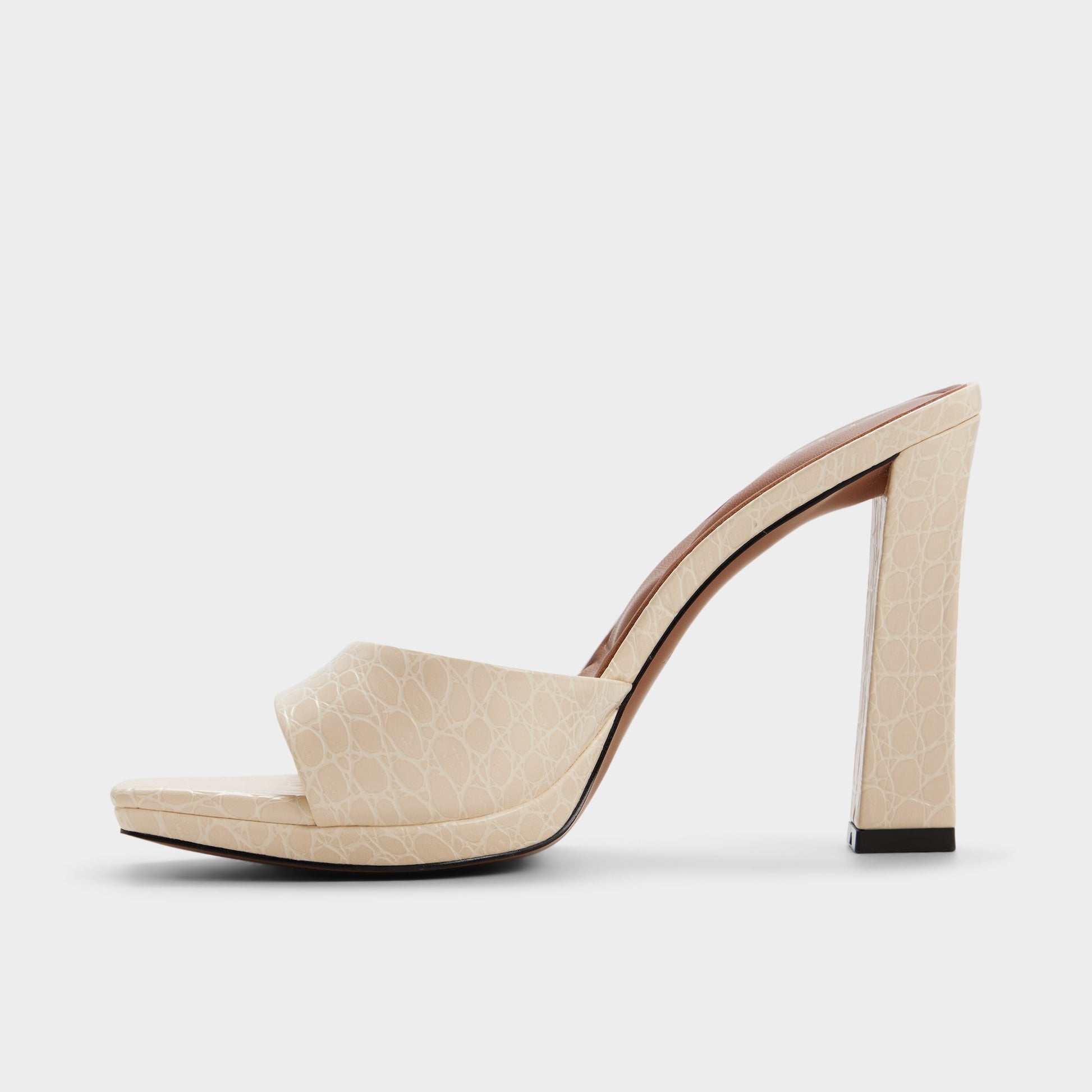 Side view of Cream Biscuiit Heeled mule