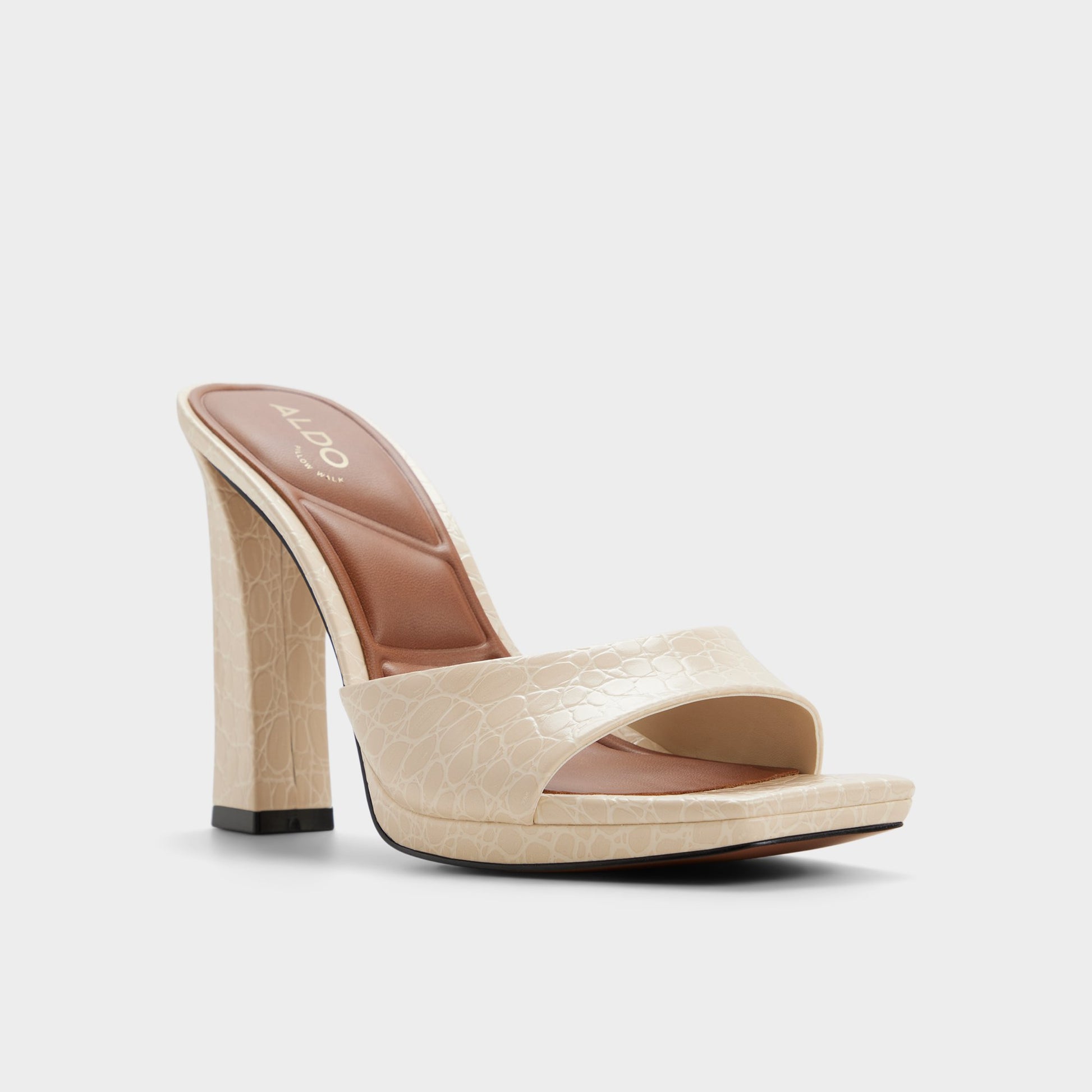 Three-quarter angle of Cream Biscuiit Heeled mule's front side