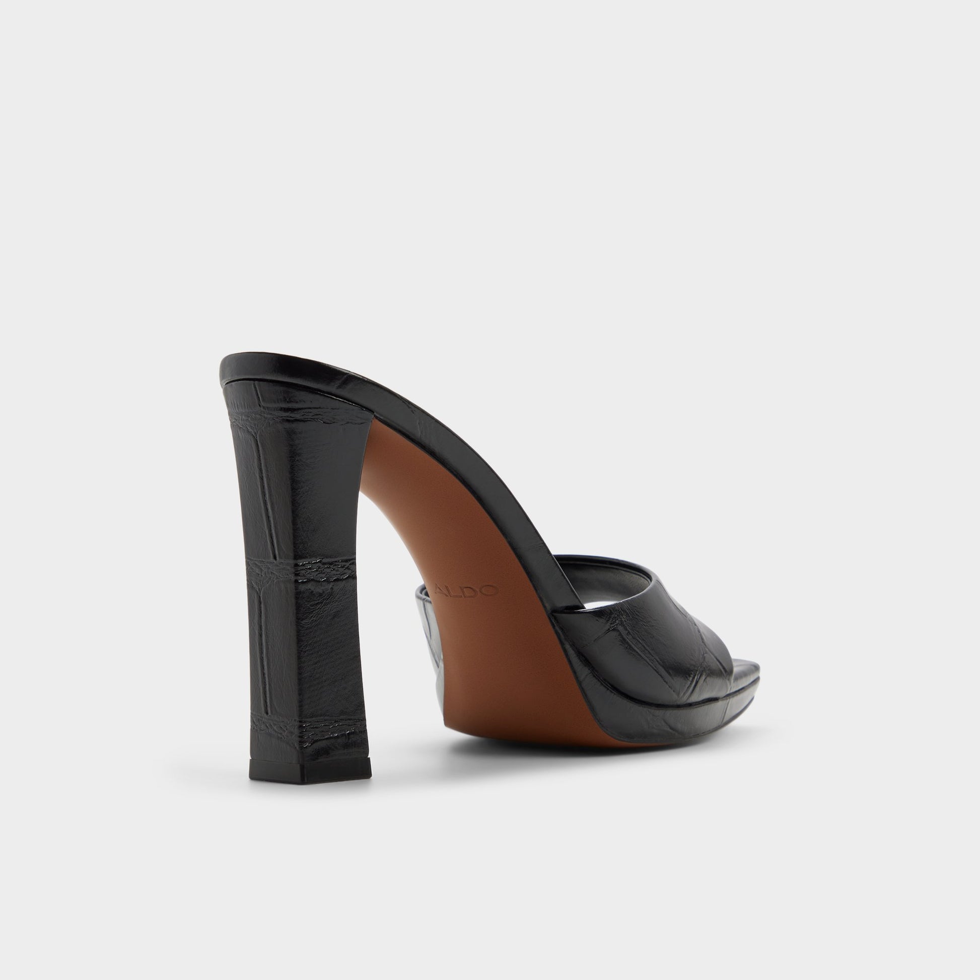Three-quarter angle of Black Biscuiit Heeled mule's back side