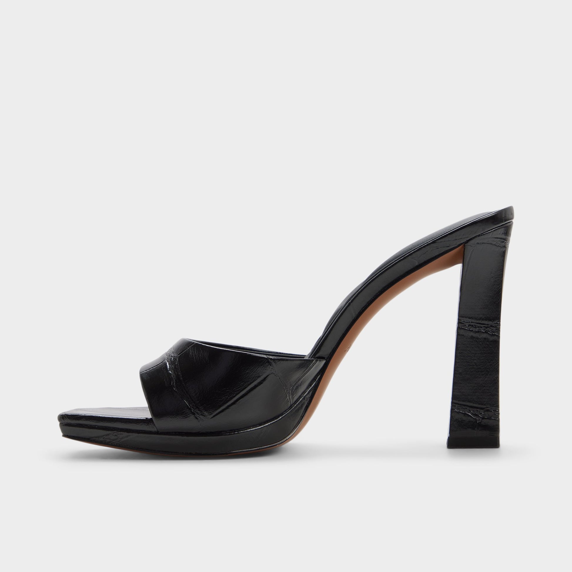 Side view of Black Biscuiit Heeled mule