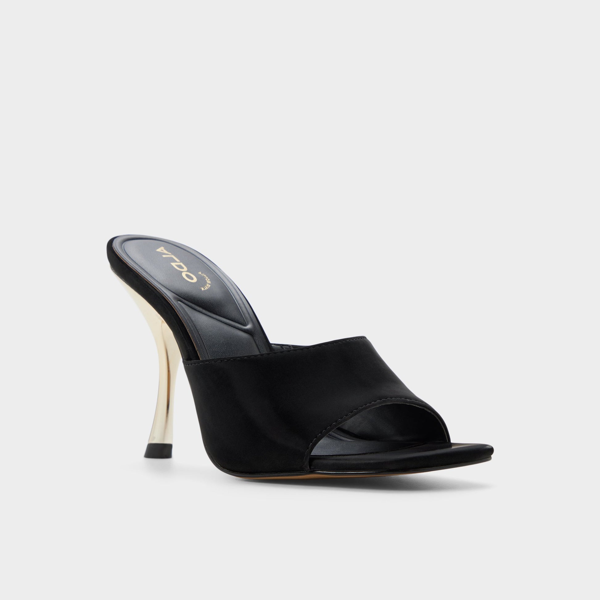 Three-quarter angle of Black Comacan Heeled mule's front side