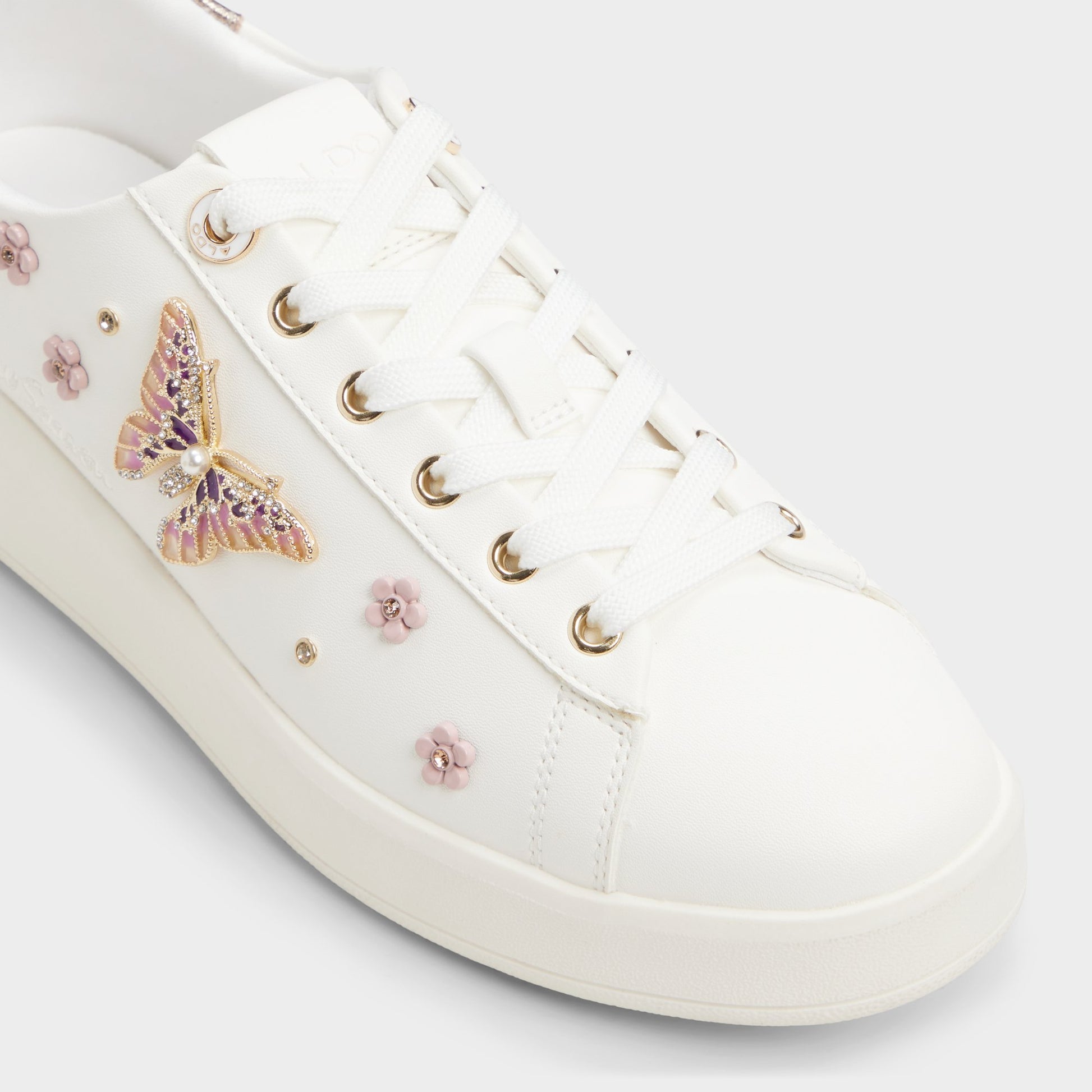 Angle de trois quarts de la face avant de Blanc Springkiss Sneaker