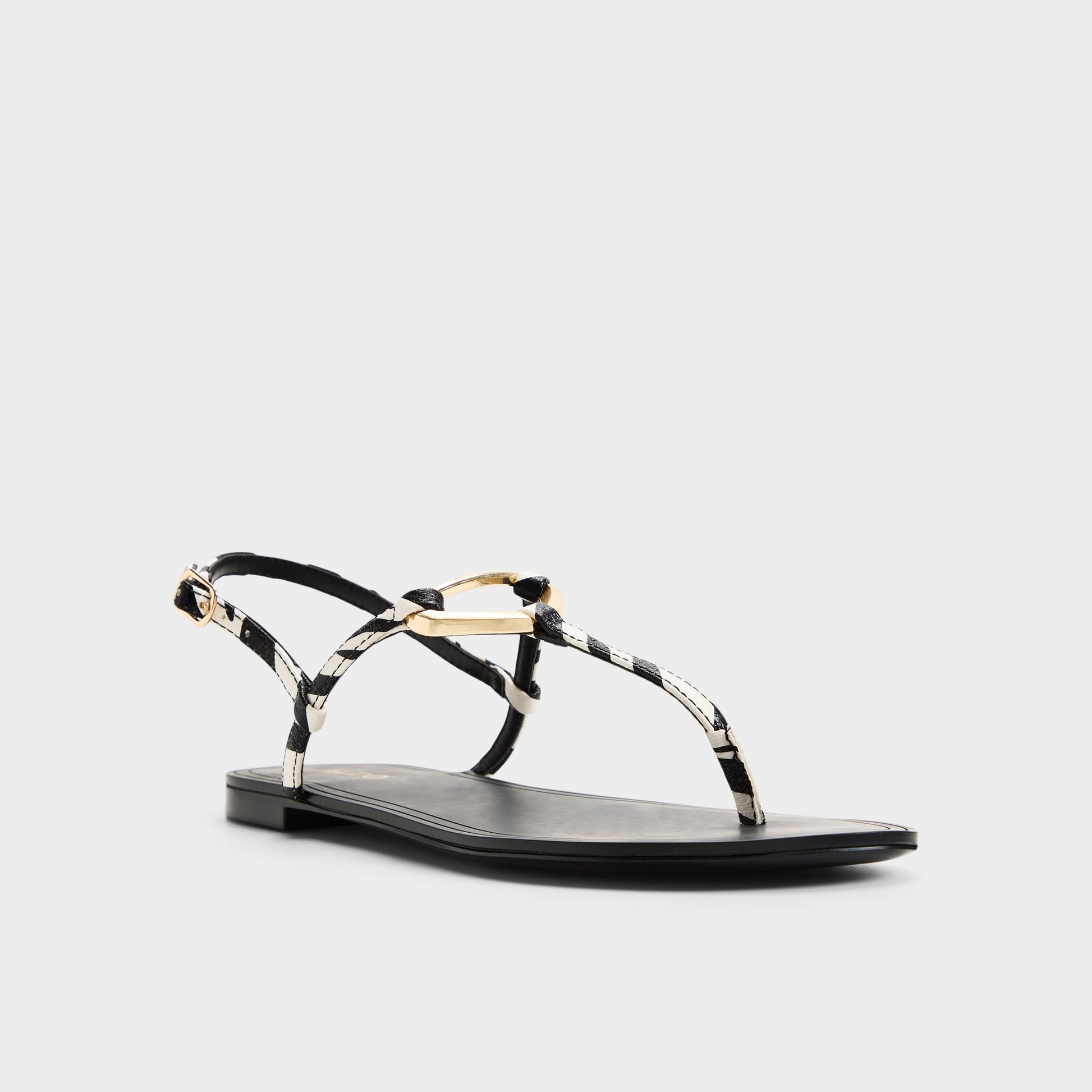 Three-quarter angle of Black/white Alannah T-strap sandal's front side