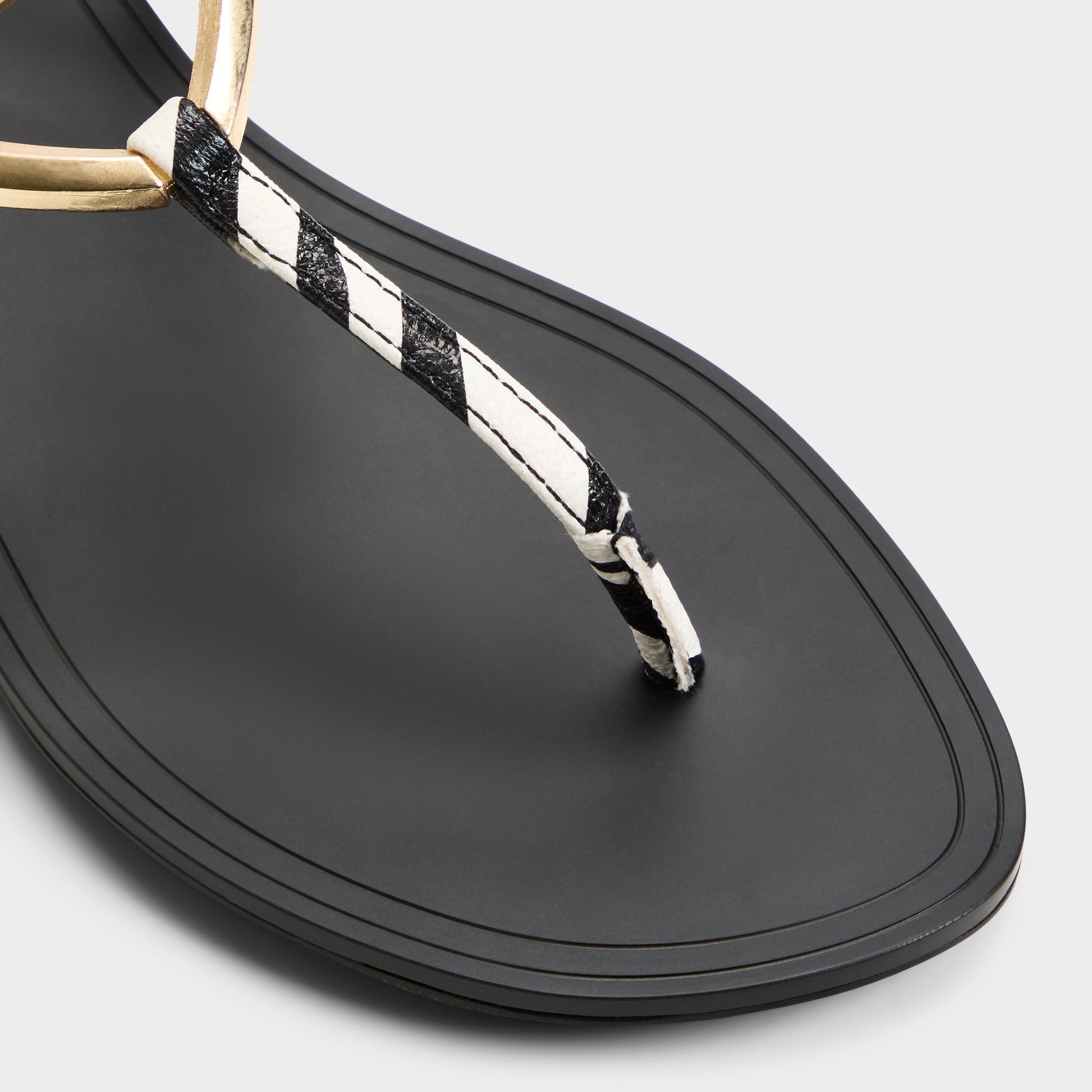 Close-up of the Black/white Alannah T-strap sandal