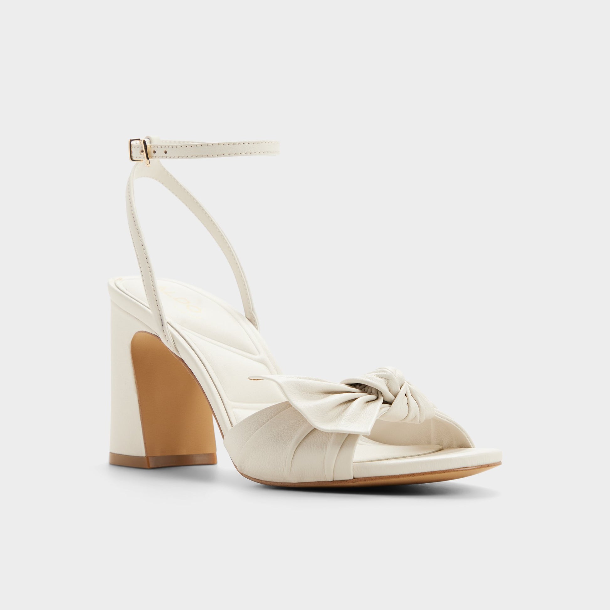 Three-quarter angle of Open white Angelknot Strappy block heeled sandal's front side