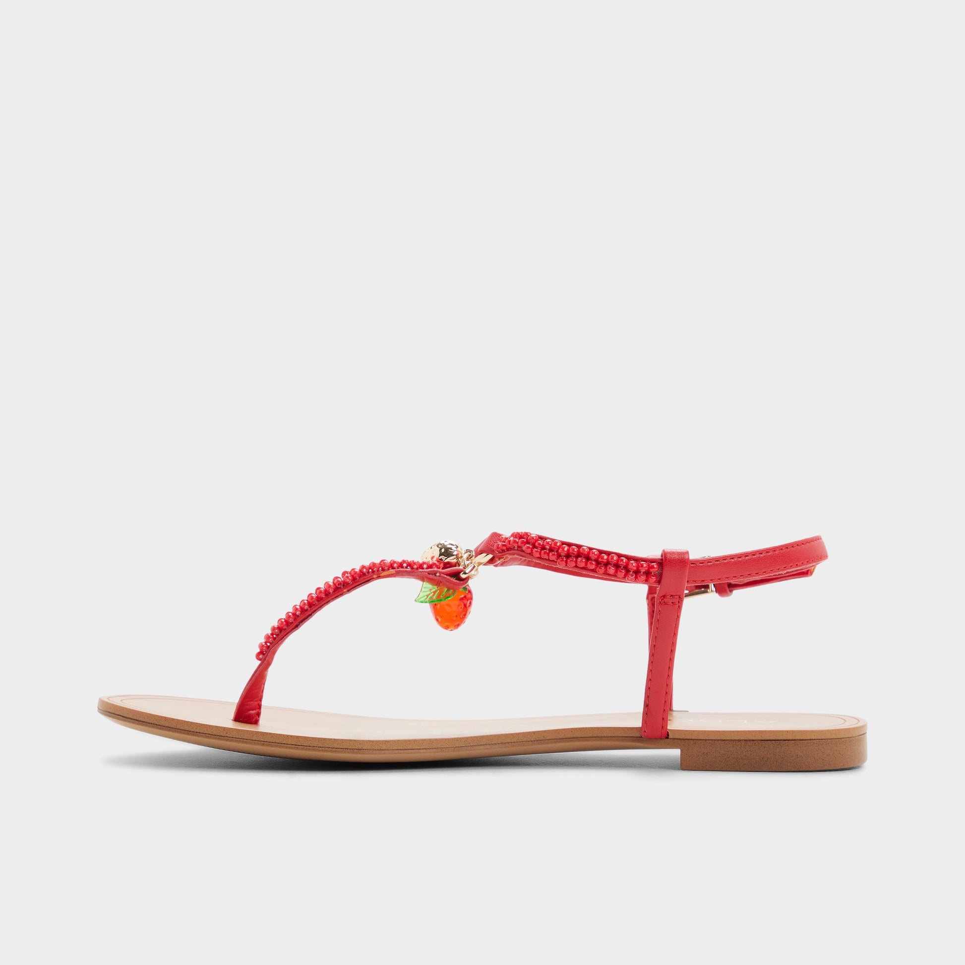 Side view of Bright red Fraisie T-strap sandal