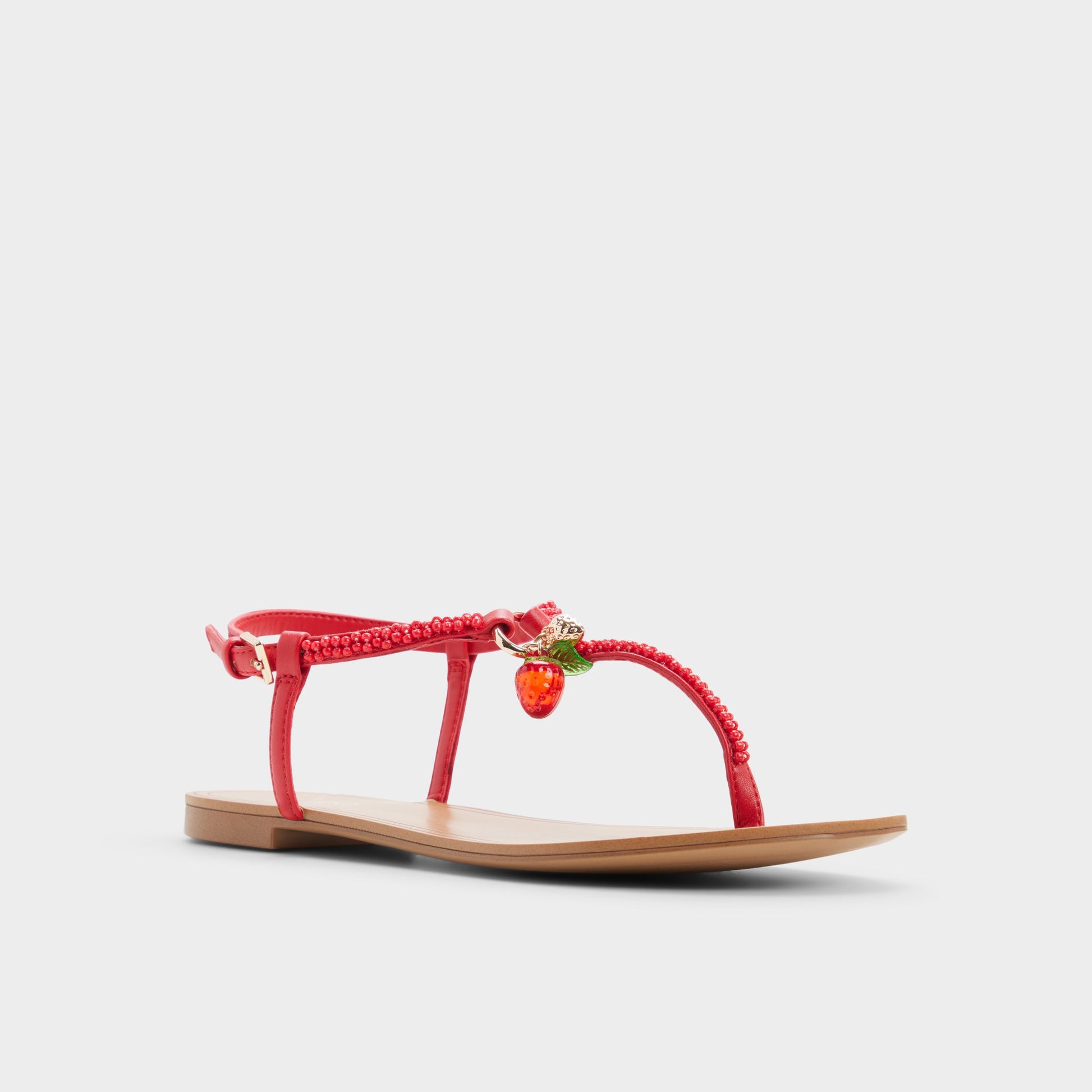 Three-quarter angle of Bright red Fraisie T-strap sandal's front side