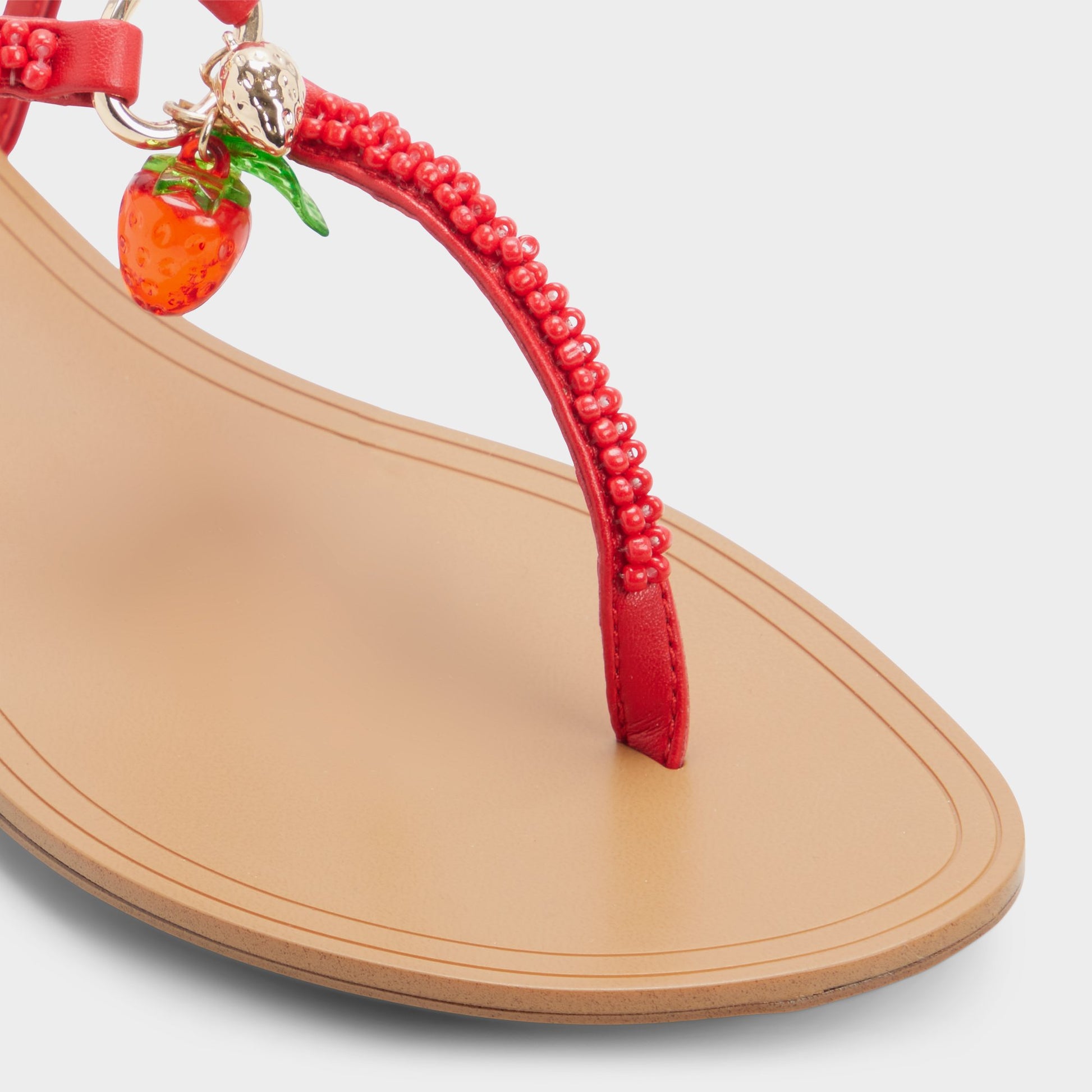 Close-up of the Bright red Fraisie T-strap sandal