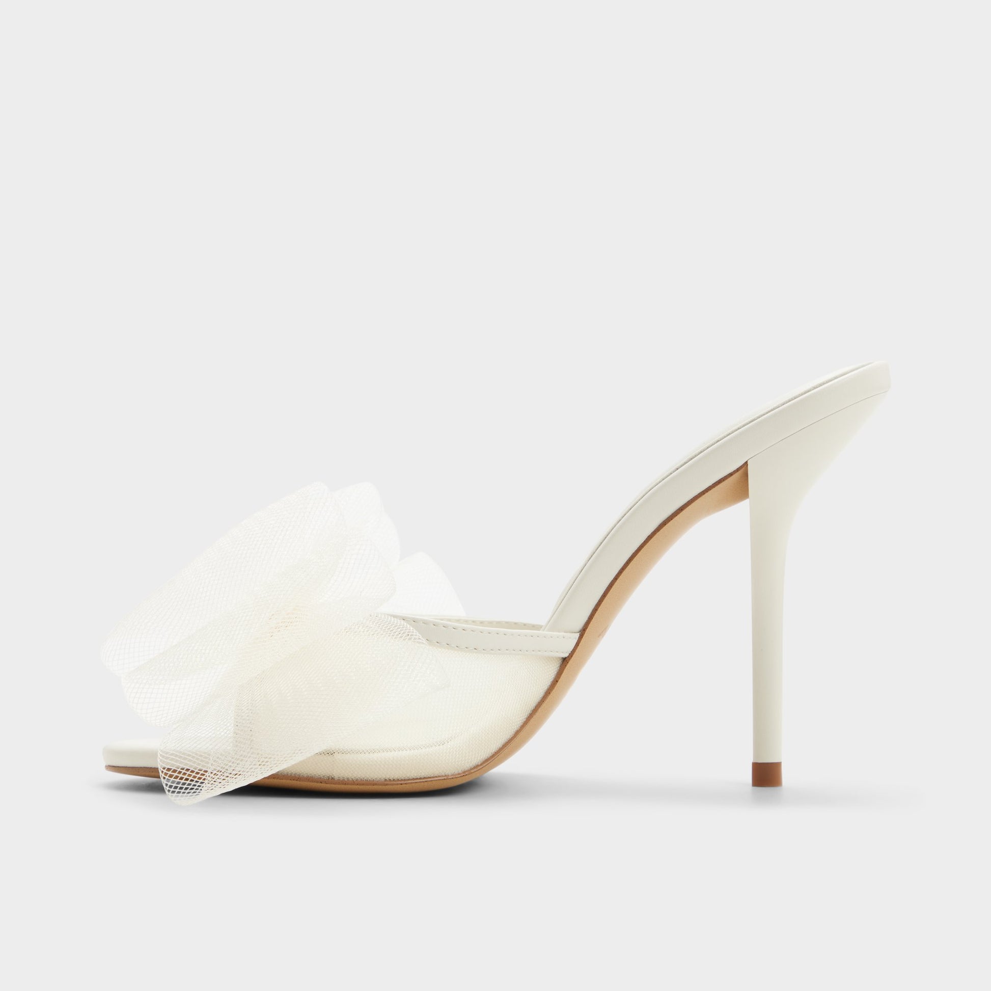 Side view of White/bone Oceanne Heeled mule