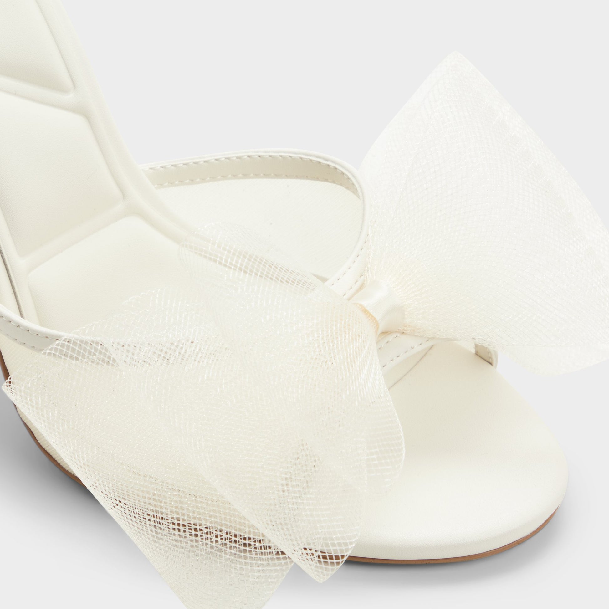 Close-up of the White/bone Oceanne Heeled mule