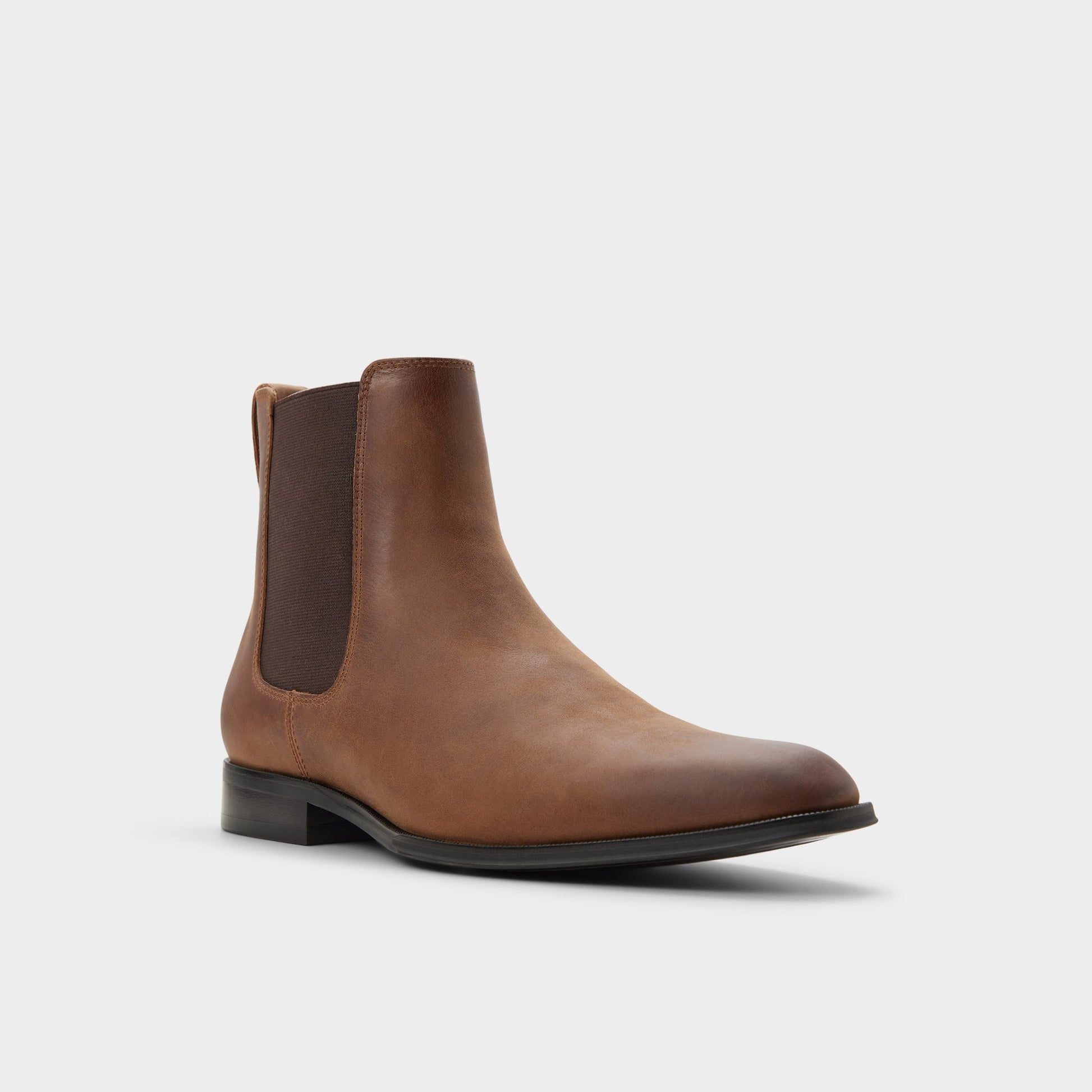 Three-quarter angle of Cognac Caspen Chelsea boot's front side