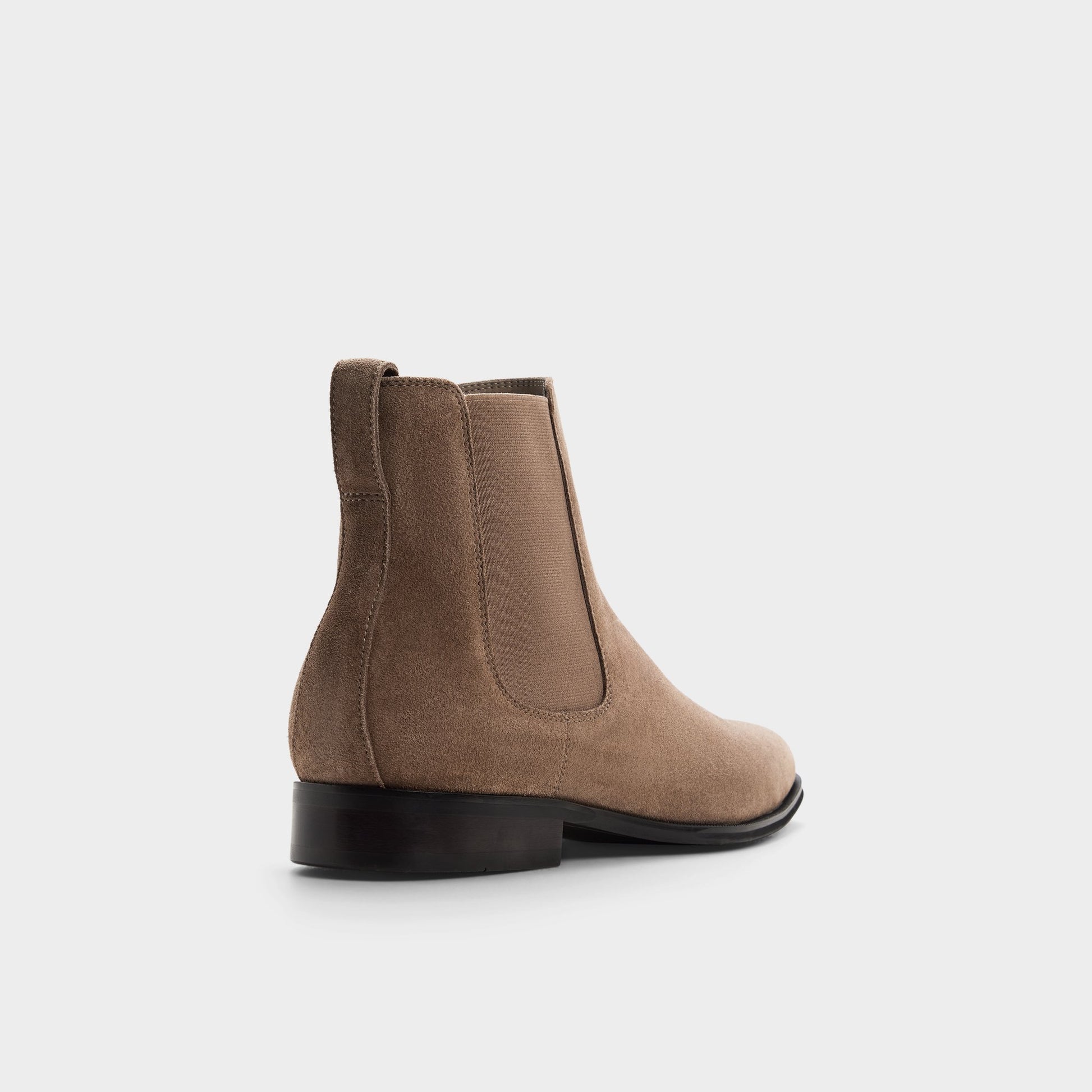 Three-quarter angle of Taupe Caspen Chelsea boot's back side