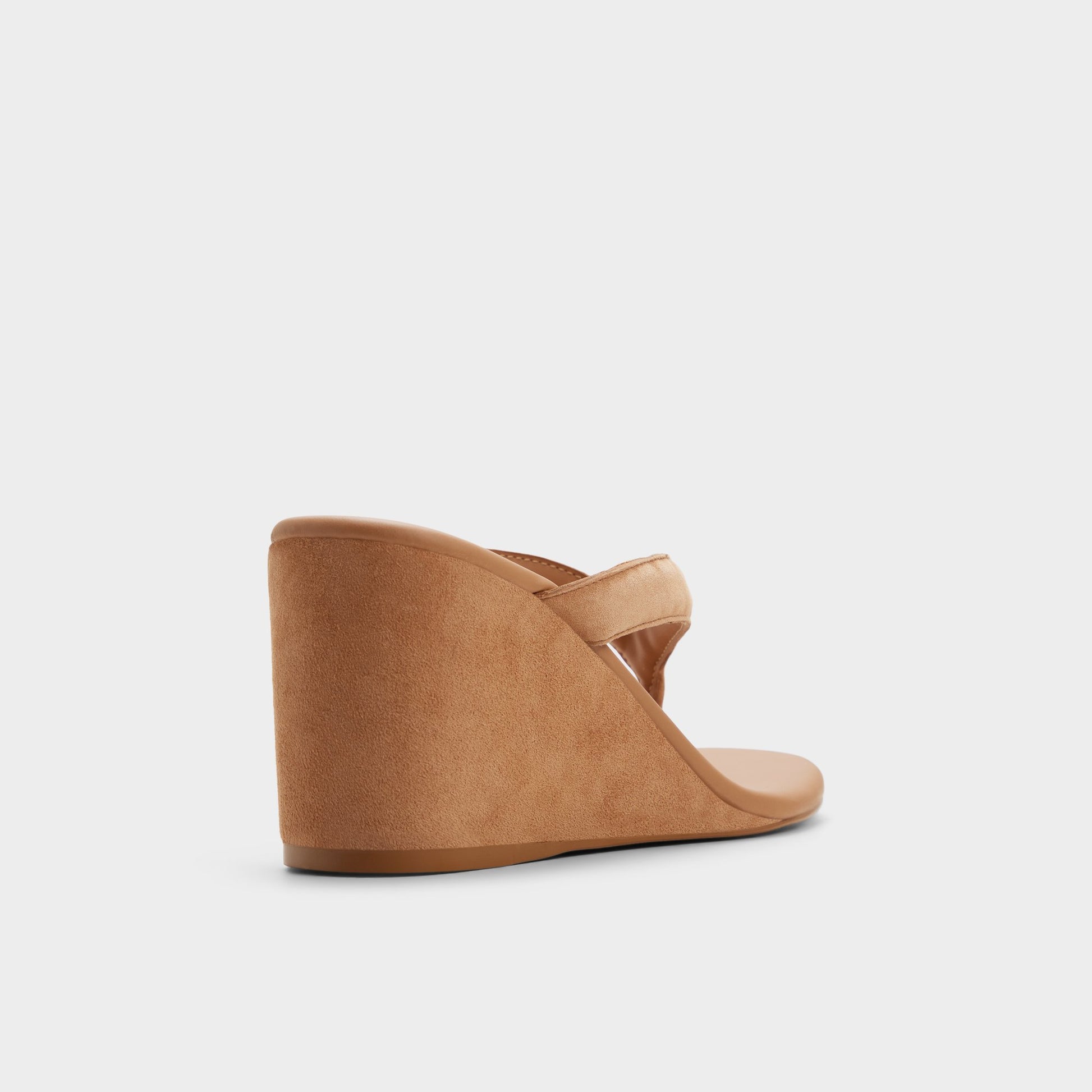 Three-quarter angle of Medium brown Isabelia Wedge thong sandal's back side