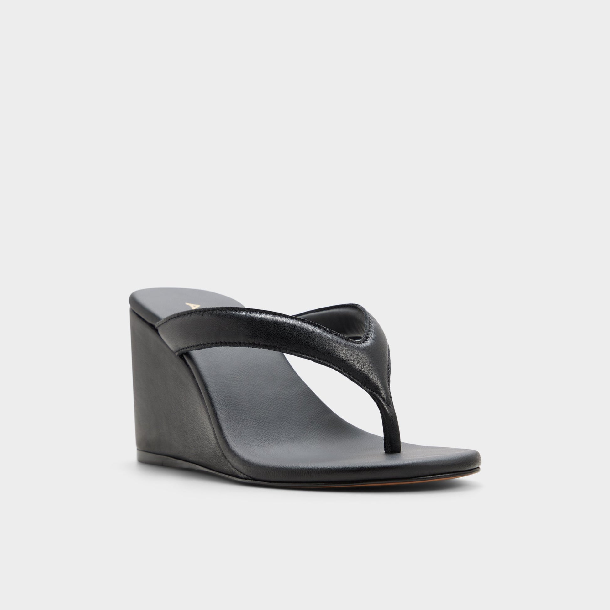 Three-quarter angle of Black Isabelia Wedge thong sandal's front side