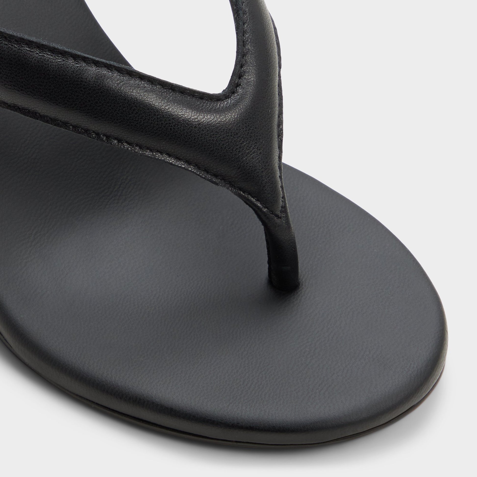 Close-up of the Black Isabelia Wedge thong sandal