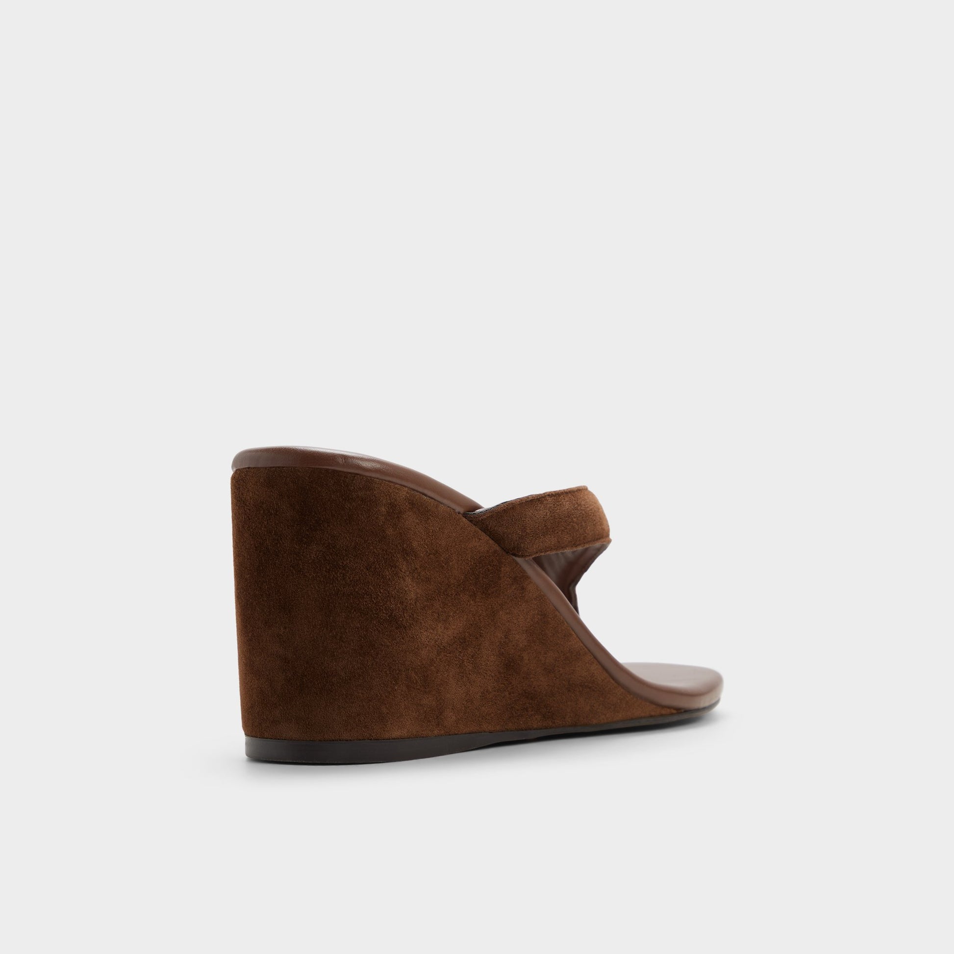 Three-quarter angle of Dark brown Isabelia Wedge thong sandal's back side
