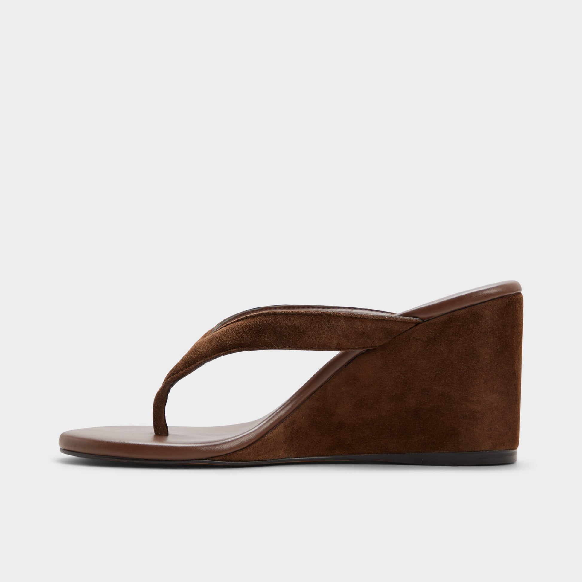 Side view of Dark brown Isabelia Wedge thong sandal