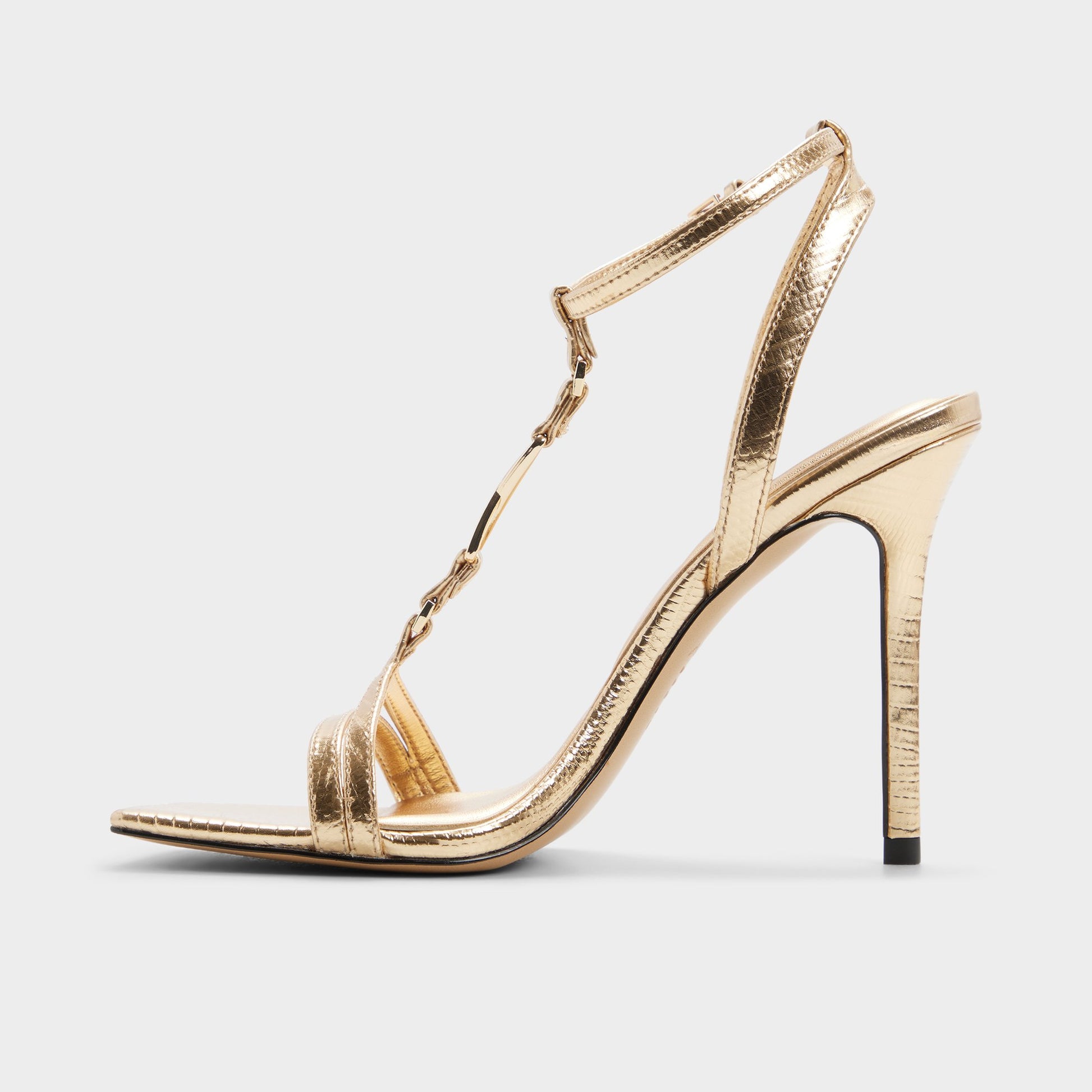 Side view of Gold Morly T-strap heeled sandal