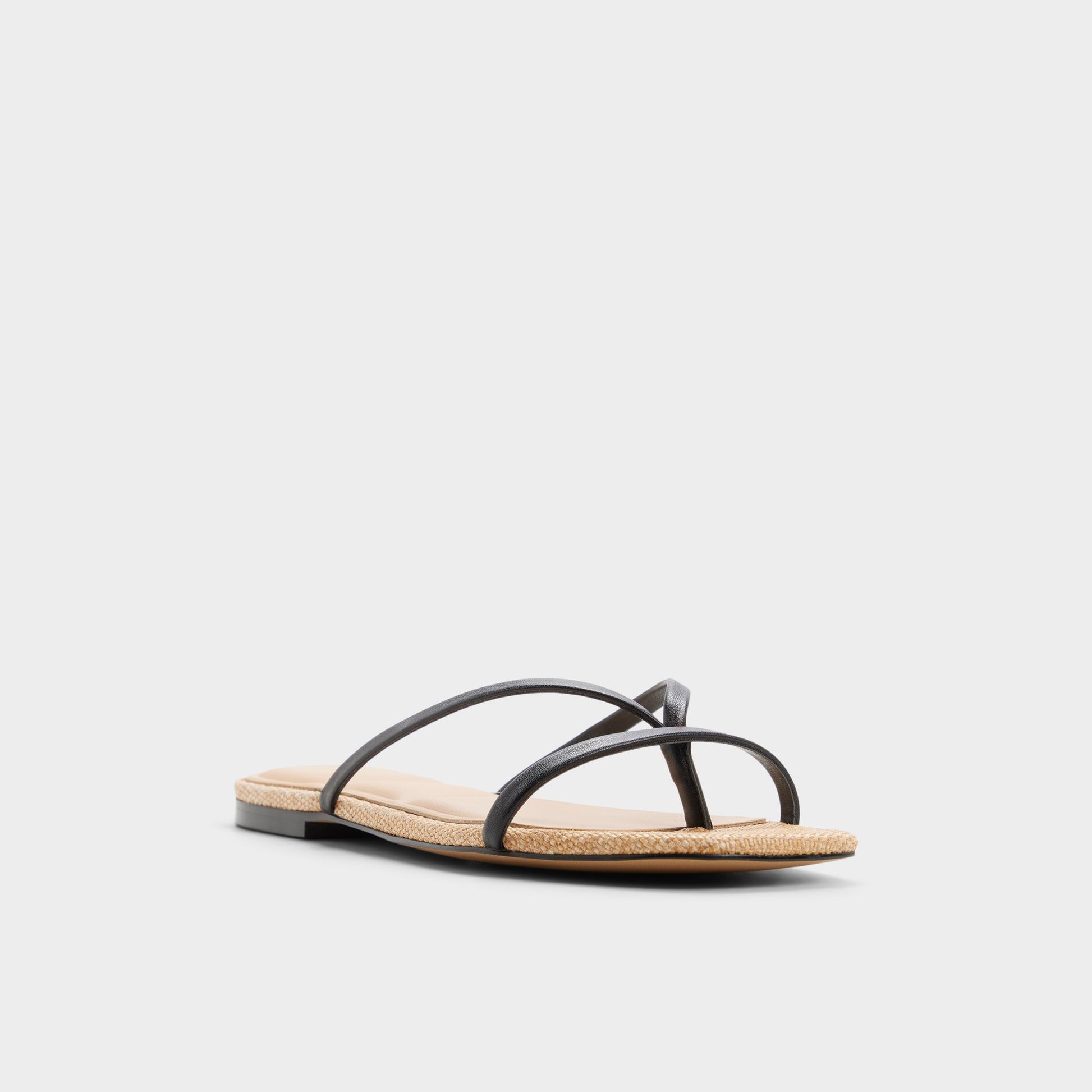 Three-quarter angle of Black combo Stivie Flip flop's front side