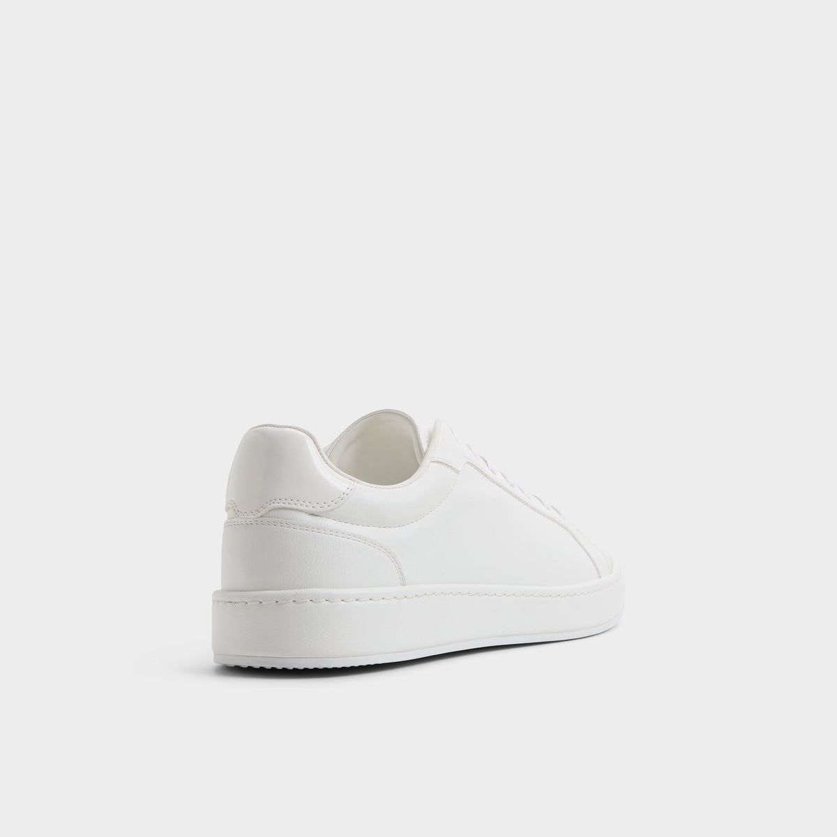 Three-quarter angle of White Joyner Low top sneaker's back side