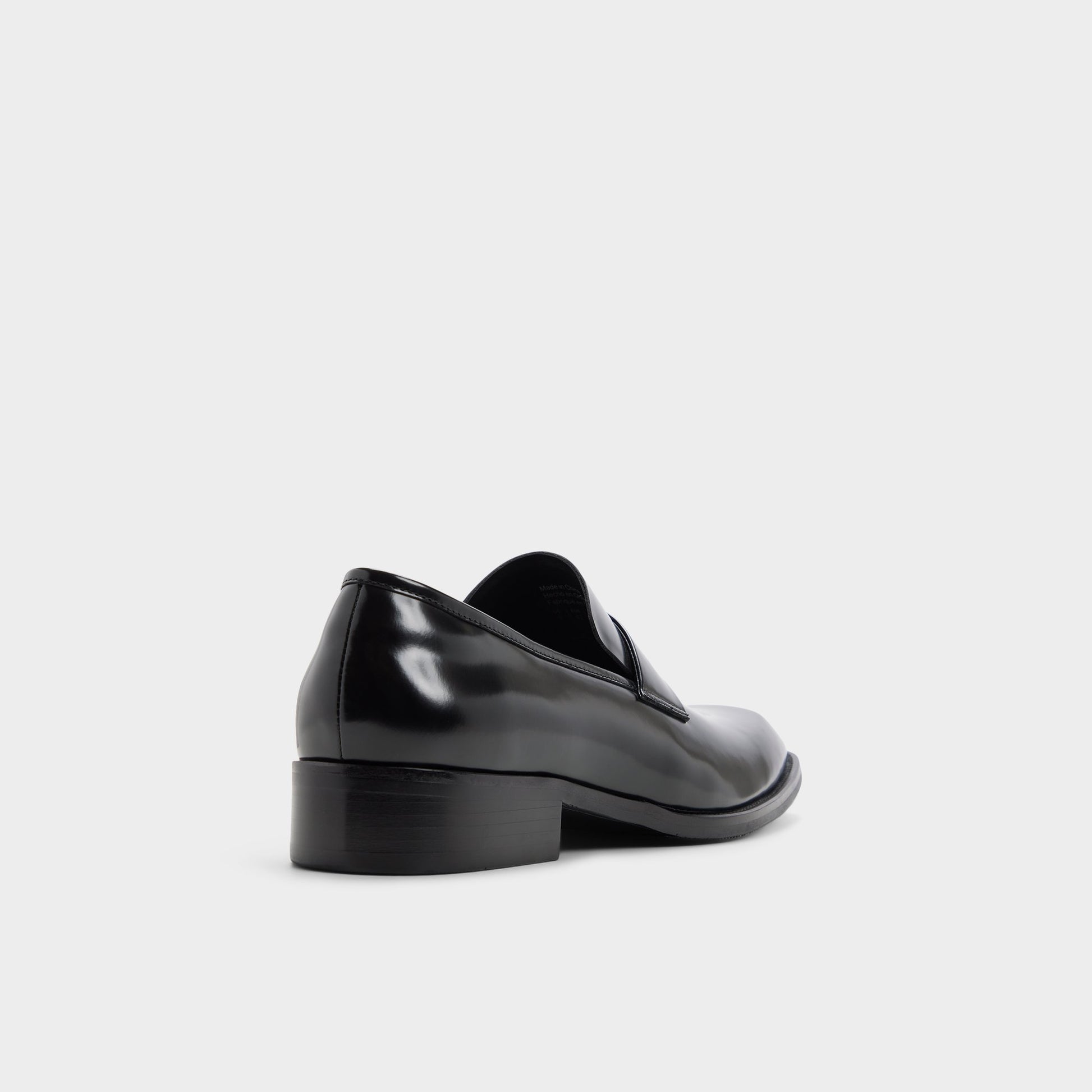 Three-quarter angle of Black Theodor Loafer's back side
