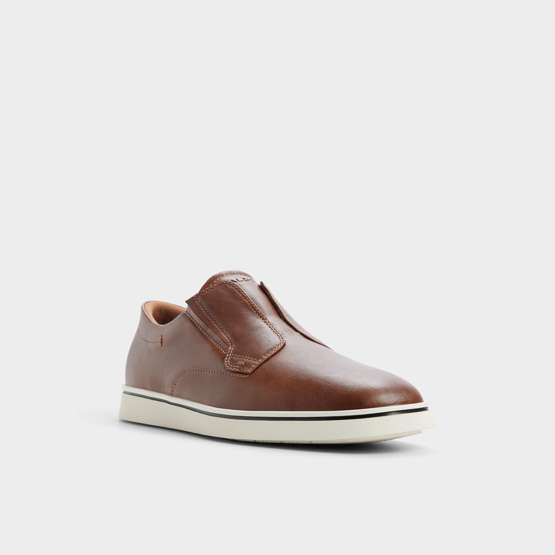 Three-quarter angle of Tan Enio Slip-on sneaker's front side