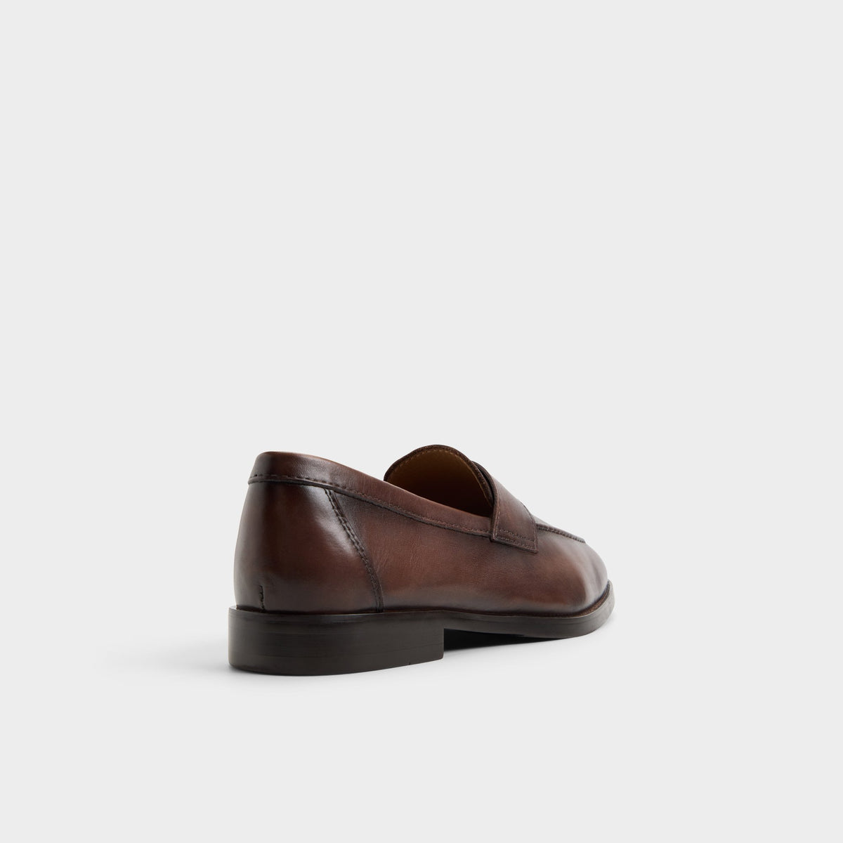 Three-quarter angle of Dark brown Iven Slip-on's back side