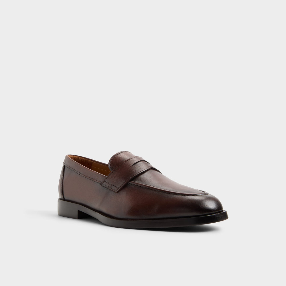 Three-quarter angle of Dark brown Iven Slip-on's front side