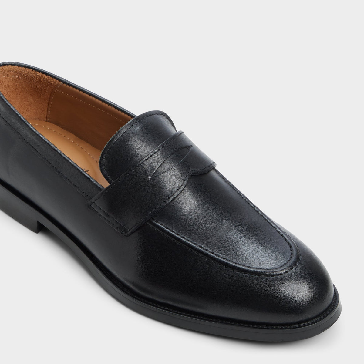 Three-quarter angle of Black Iven Slip-on's front side