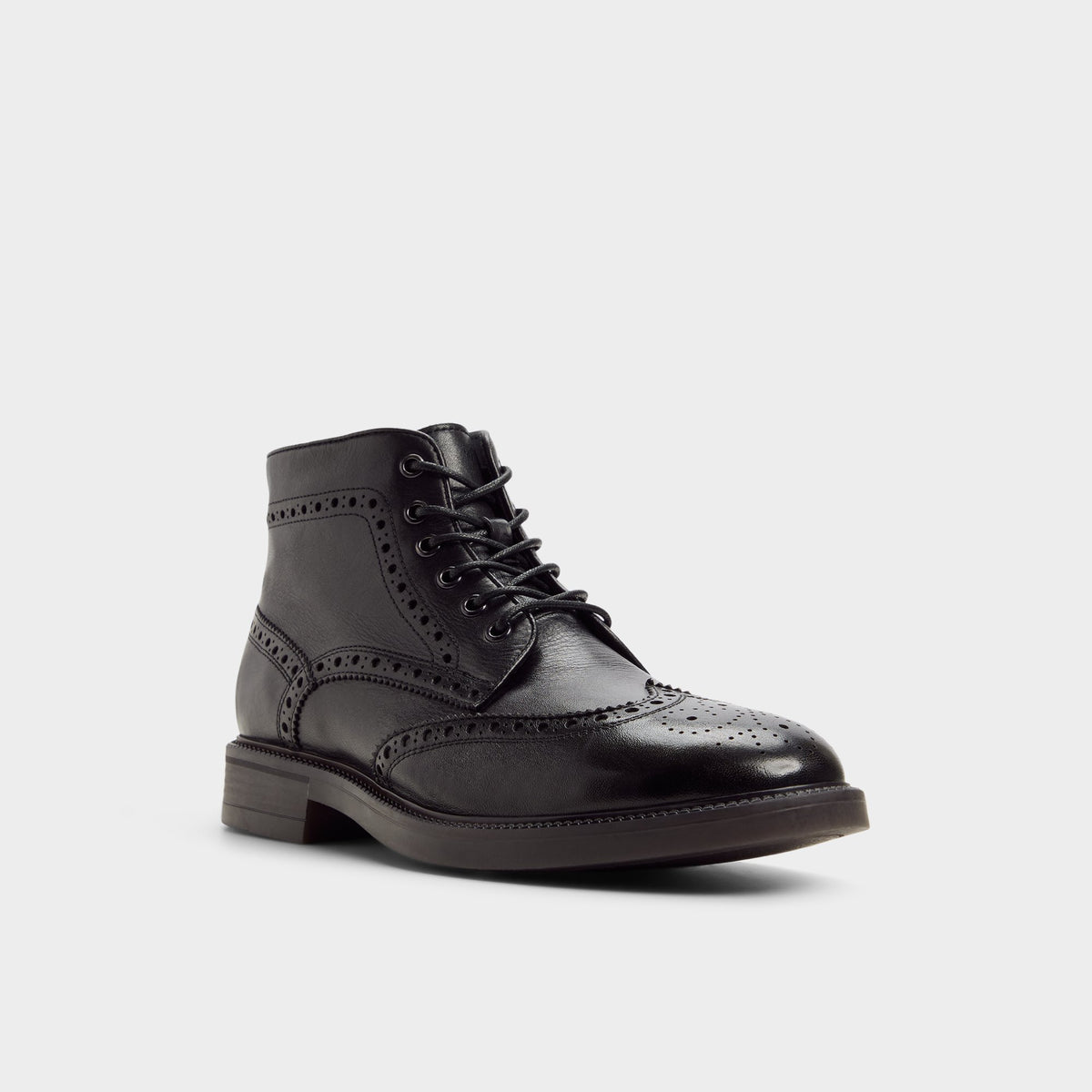 Three-quarter angle of Black Colombo Brogue ankle boot's front side