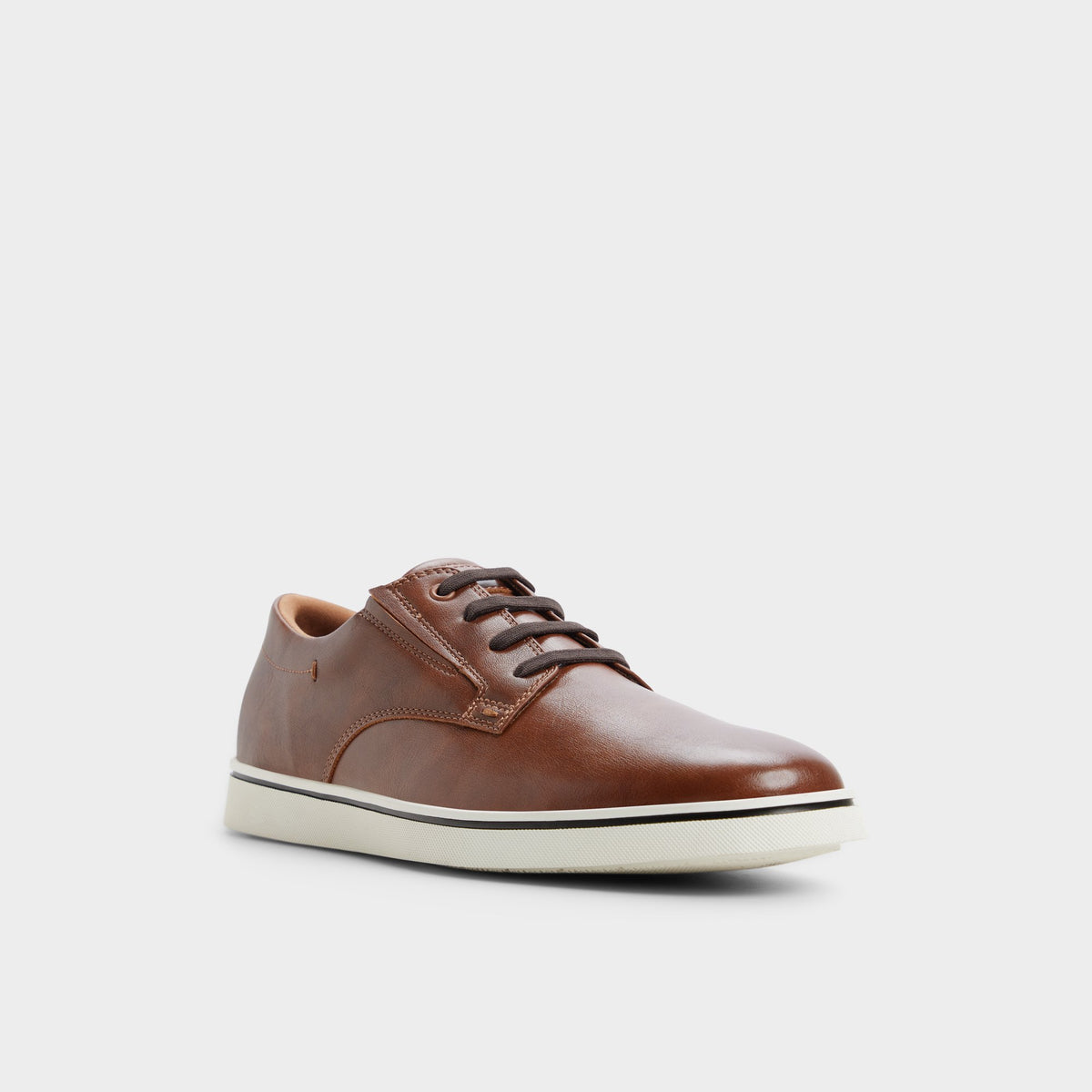 Three-quarter angle of Tan Dougie Slip-on sneaker's front side