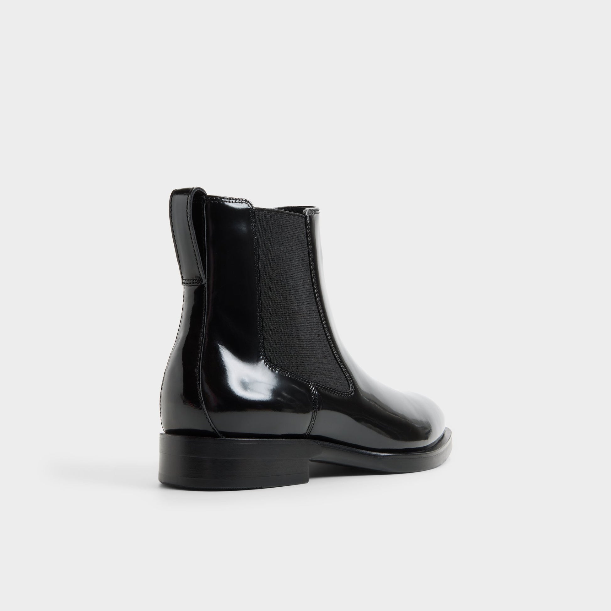 Three-quarter angle of Black Nik Chelsea boot's back side