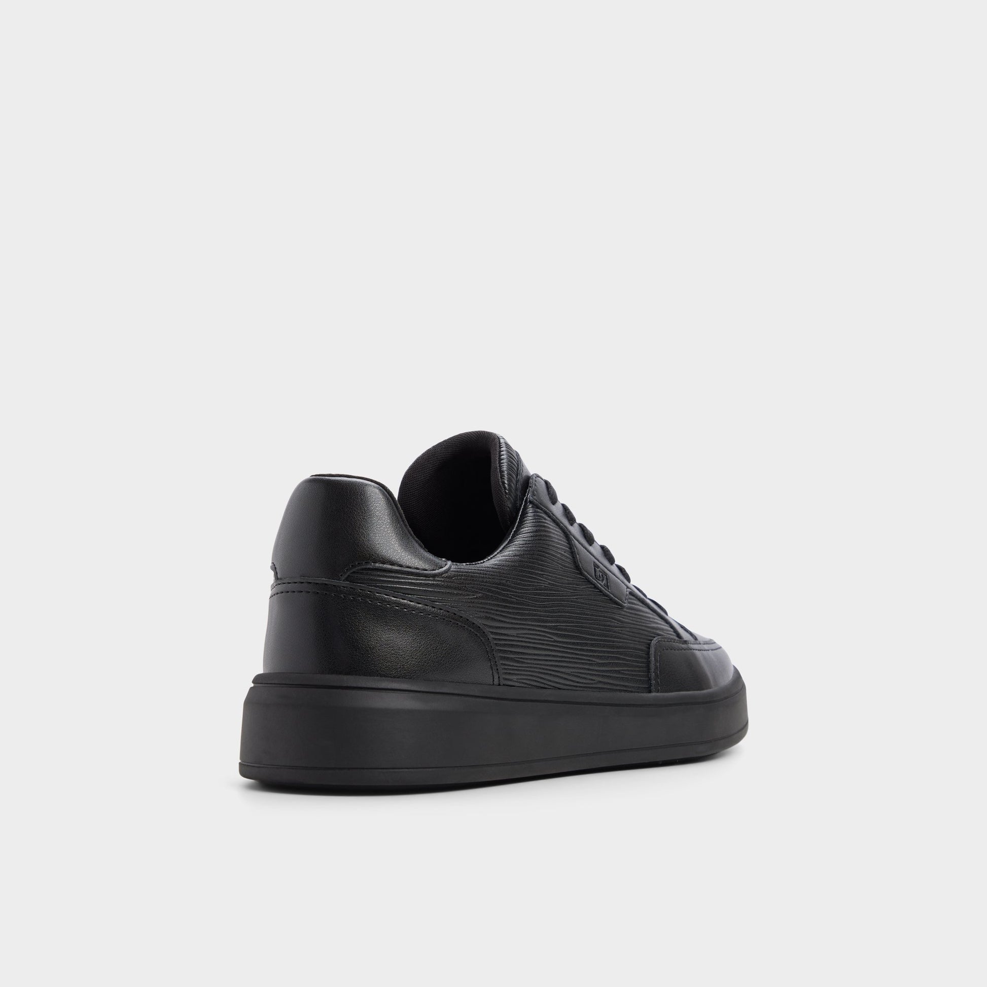 Three-quarter angle of Black/black Miko Low top sneaker's back side