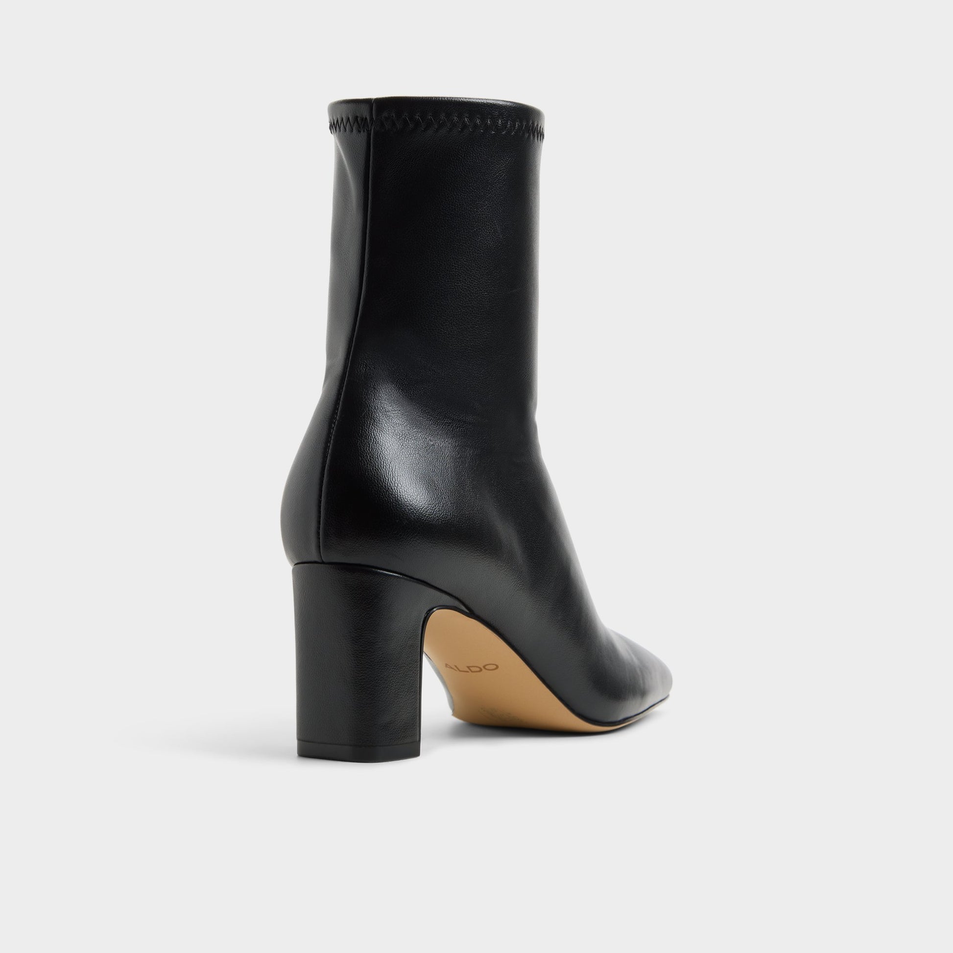 Three-quarter angle of Black Kayia Block heel ankle boot's back side