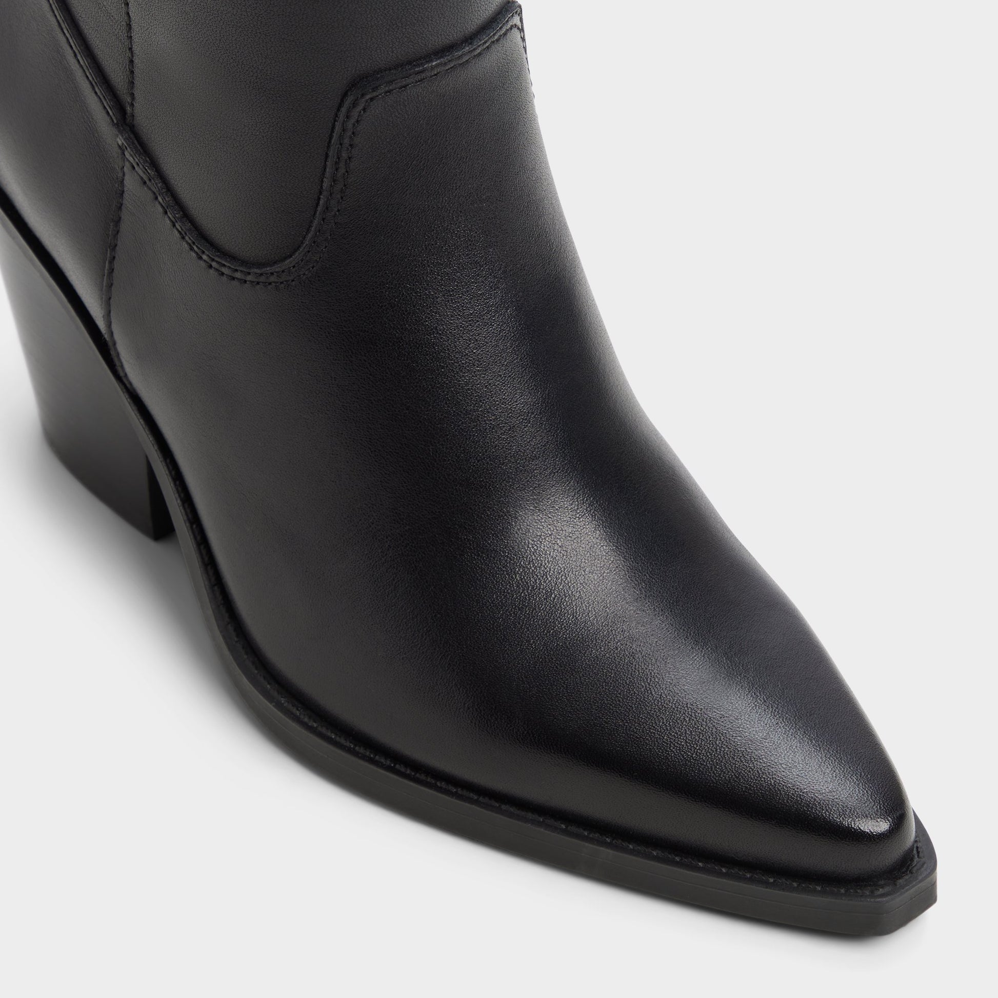 Three-quarter angle of Black Dixy Western over-the-knee boot's front side