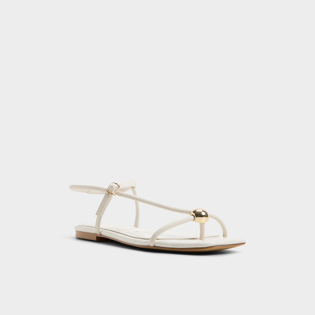Three-quarter angle of White/bone Zaelle Strappy flat sandal's front side