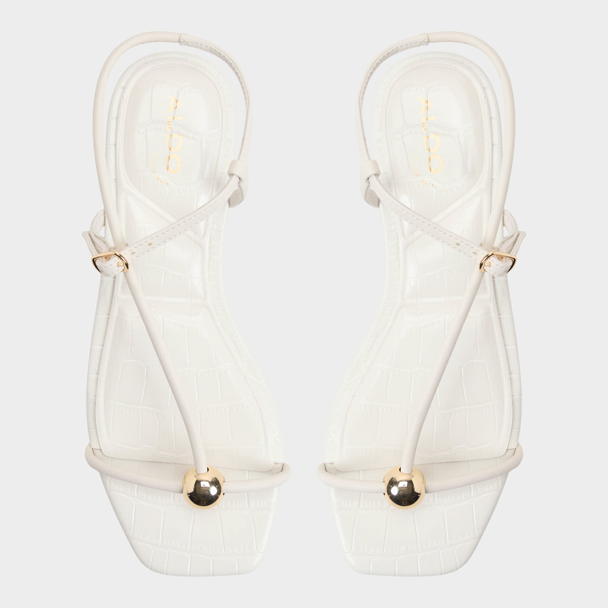 Top-down view of the White/bone Zaelle Strappy flat sandal