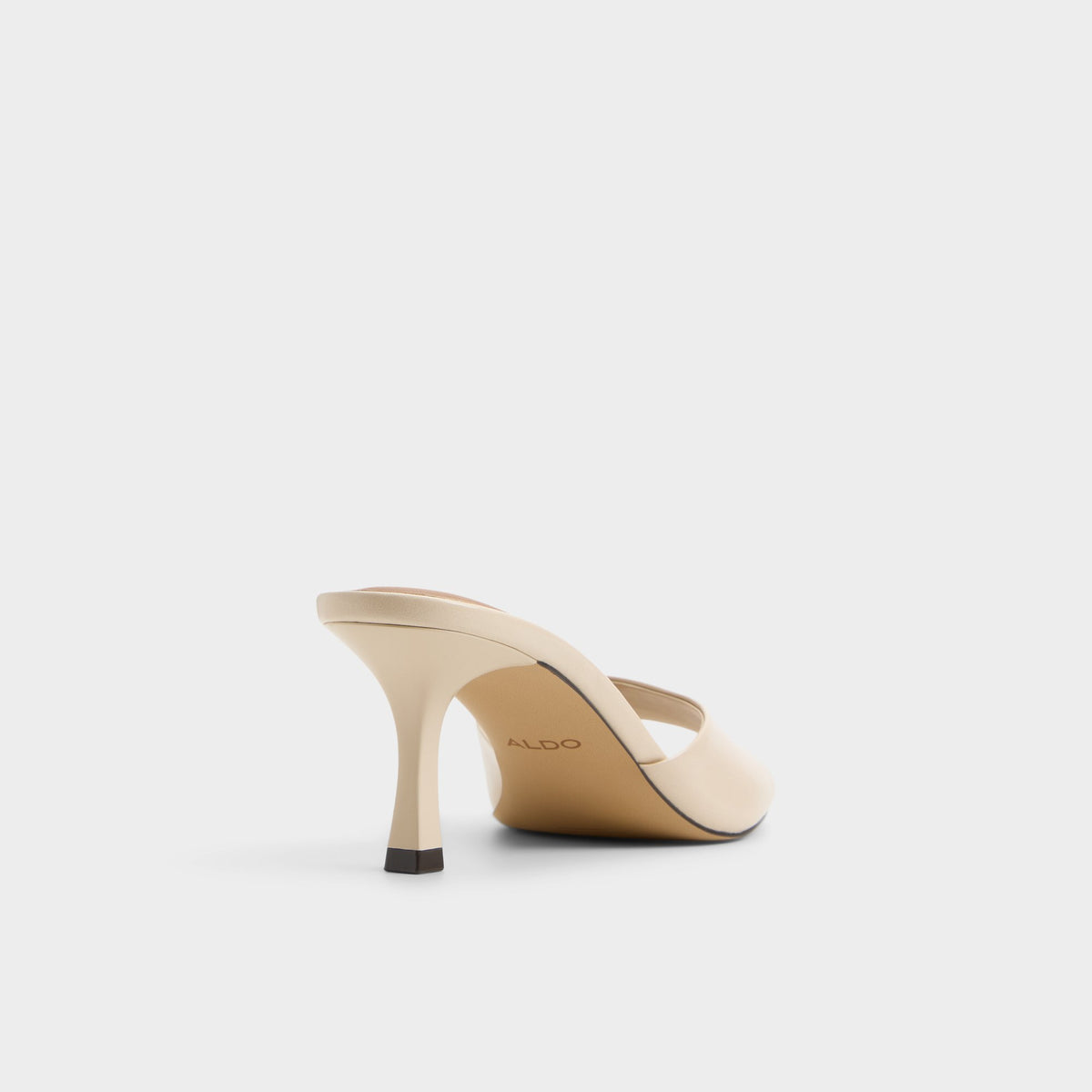Three-quarter angle of Cream Annaberaen Heeled mule's back side