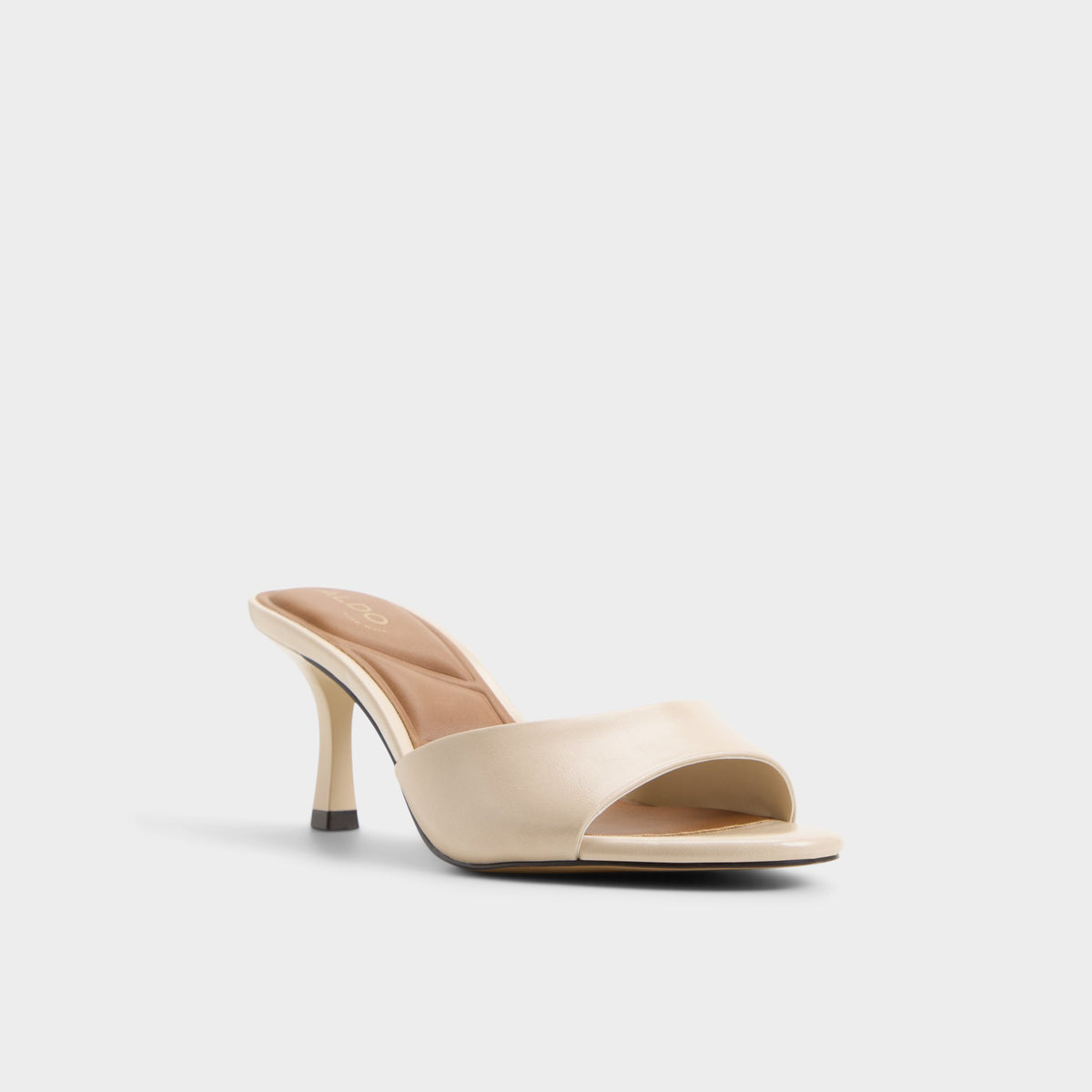 Three-quarter angle of Cream Annaberaen Heeled mule's front side