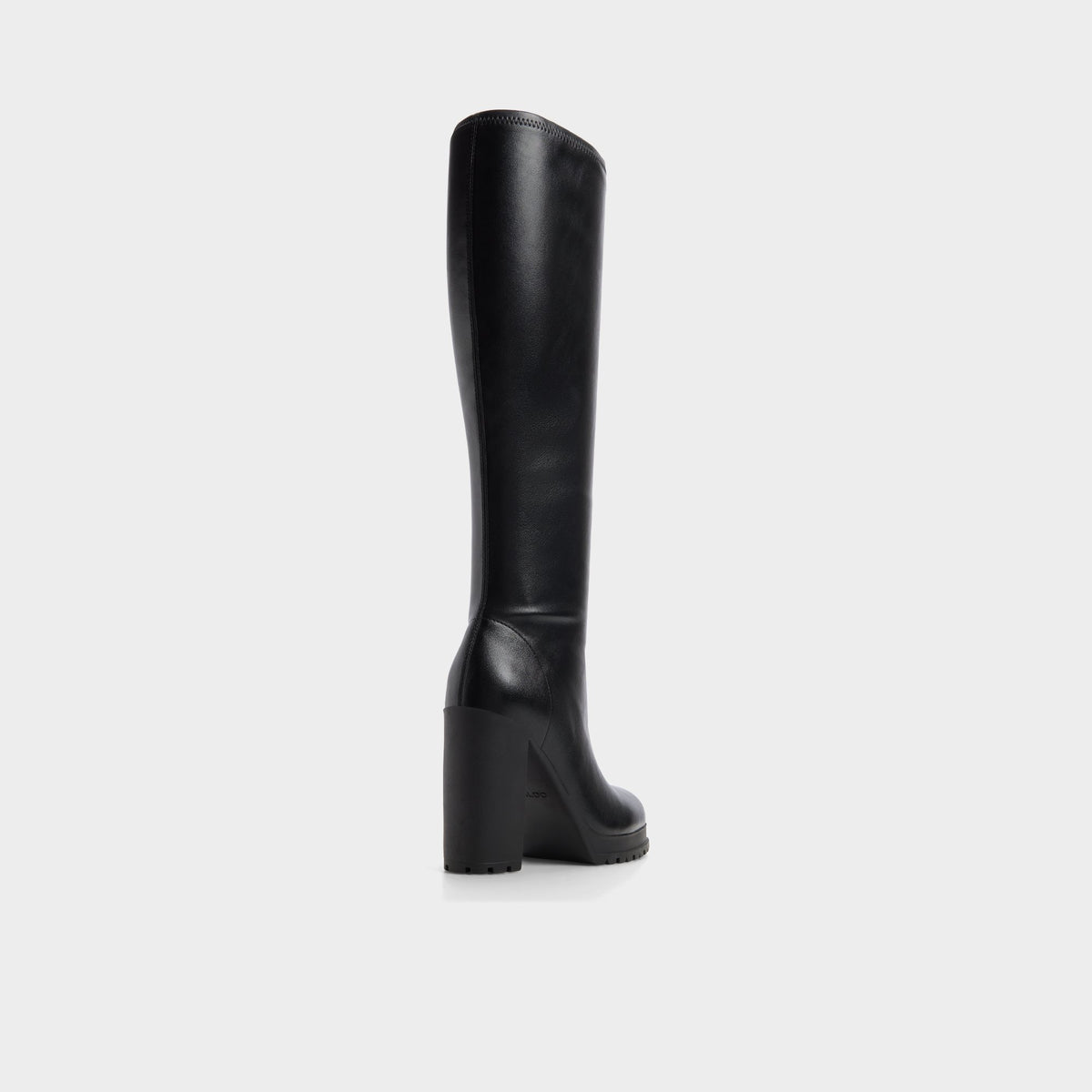 Three-quarter angle of Black Boldette Lug sole knee-high boot's back side