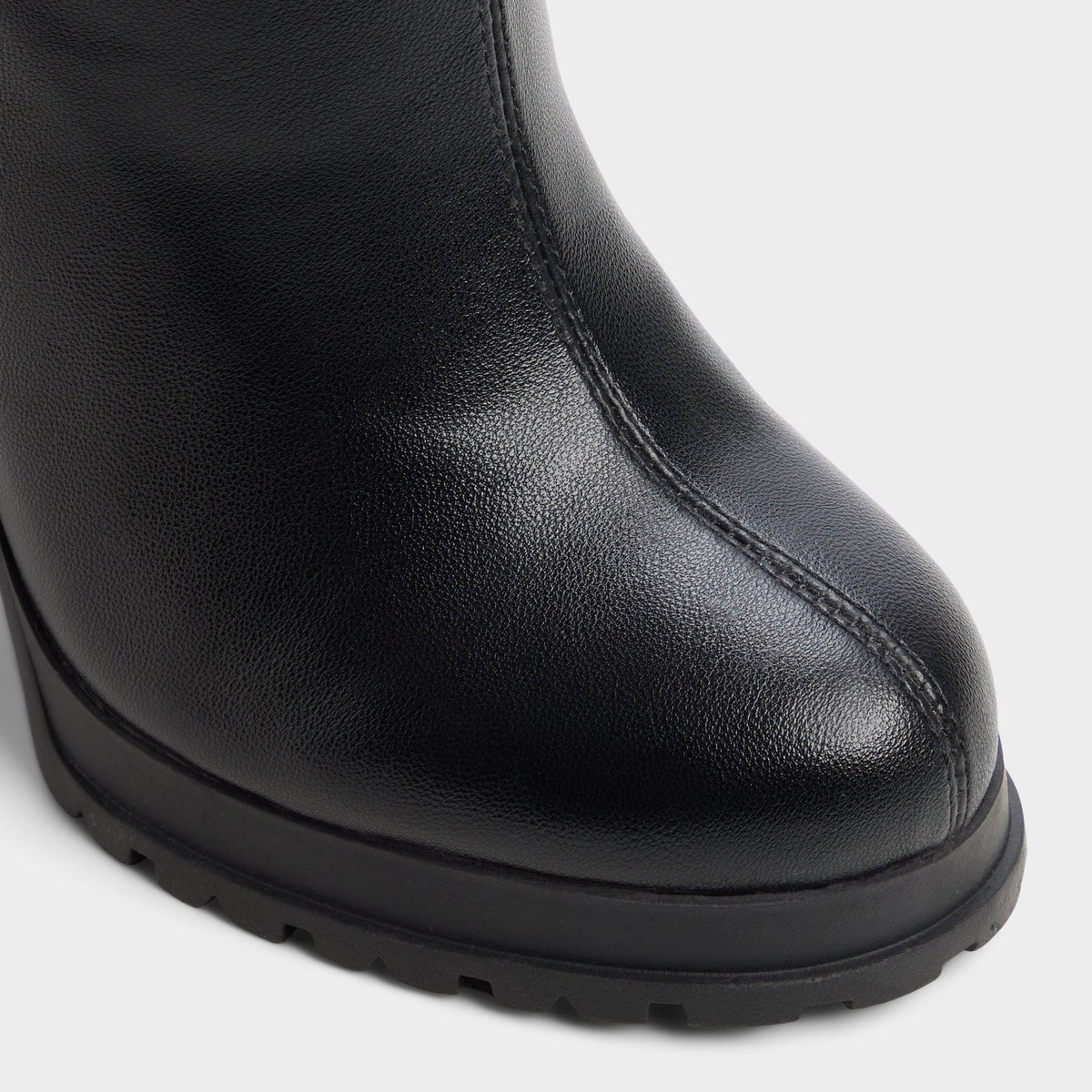 Close-up of the Black Boldette Lug sole knee-high boot