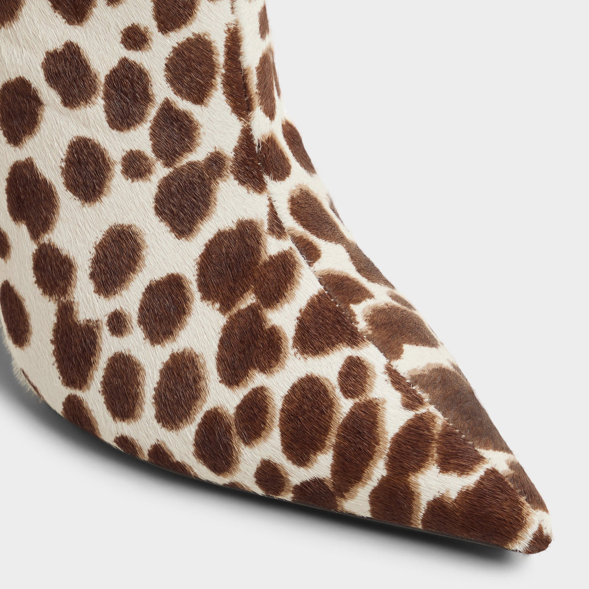 Close-up of the Cream multi Zalya Wedge heel knee-high boot