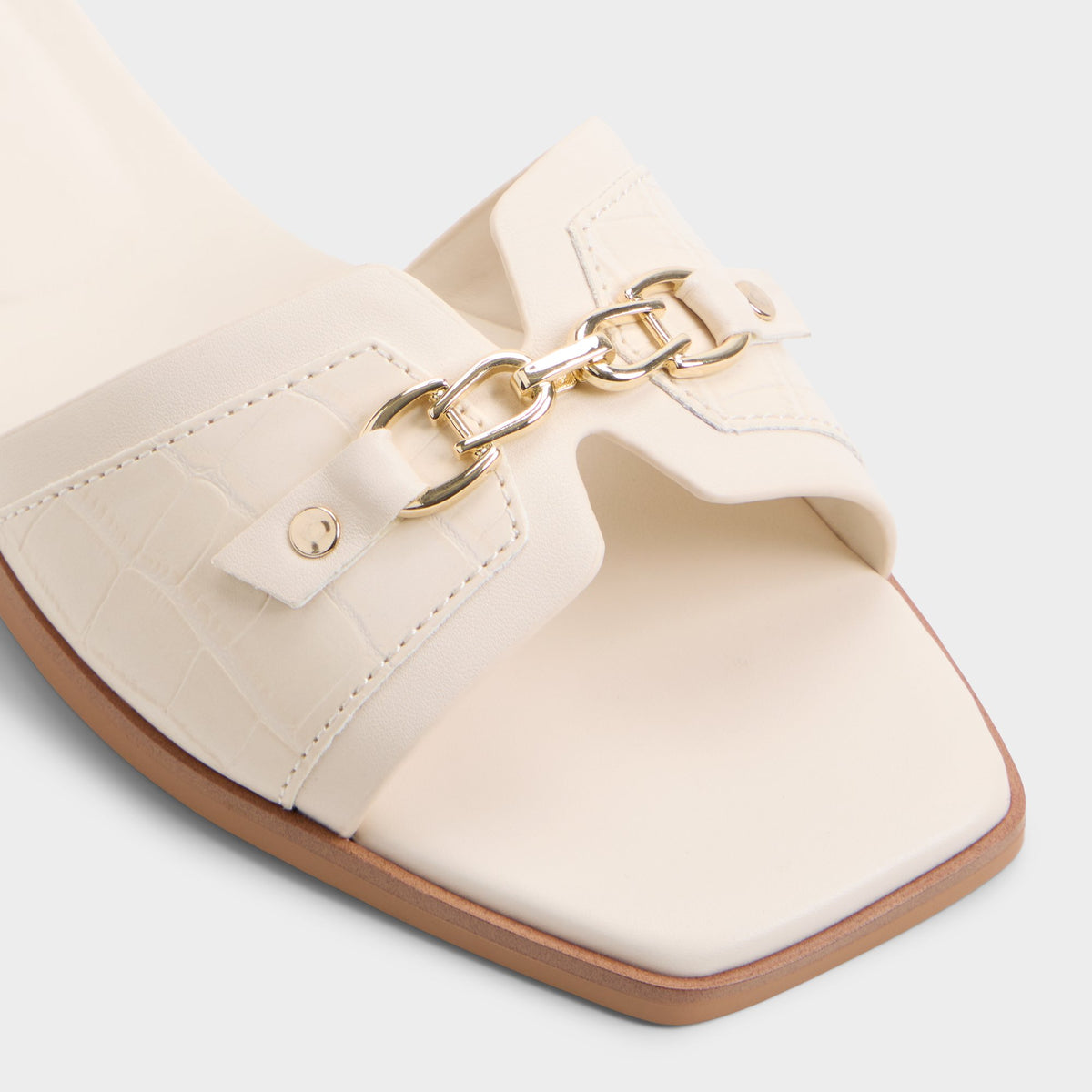 Close-up of the White/bone Alo Slide sandal