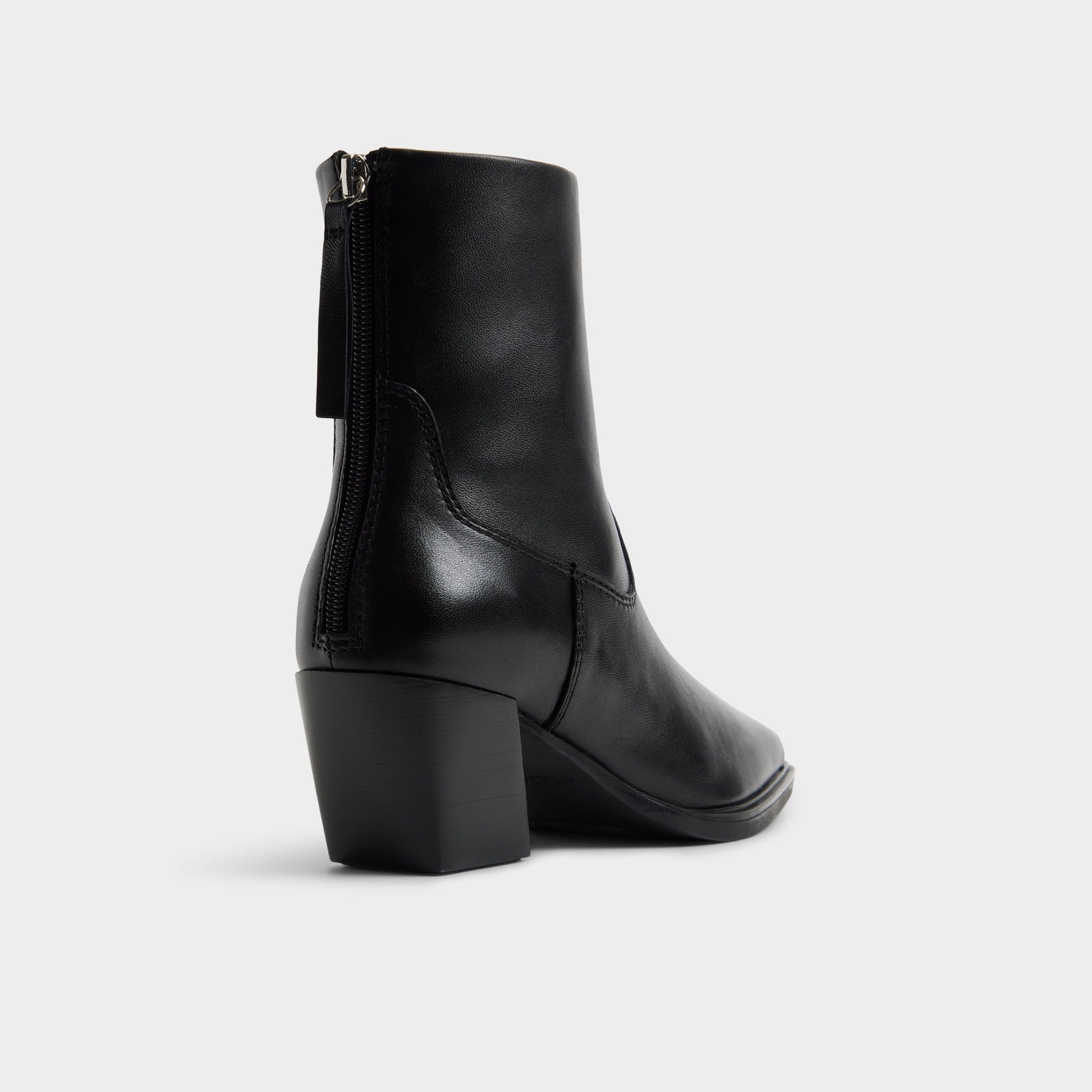 Three-quarter angle of Black Ybiraweth Block heel ankle boot's back side