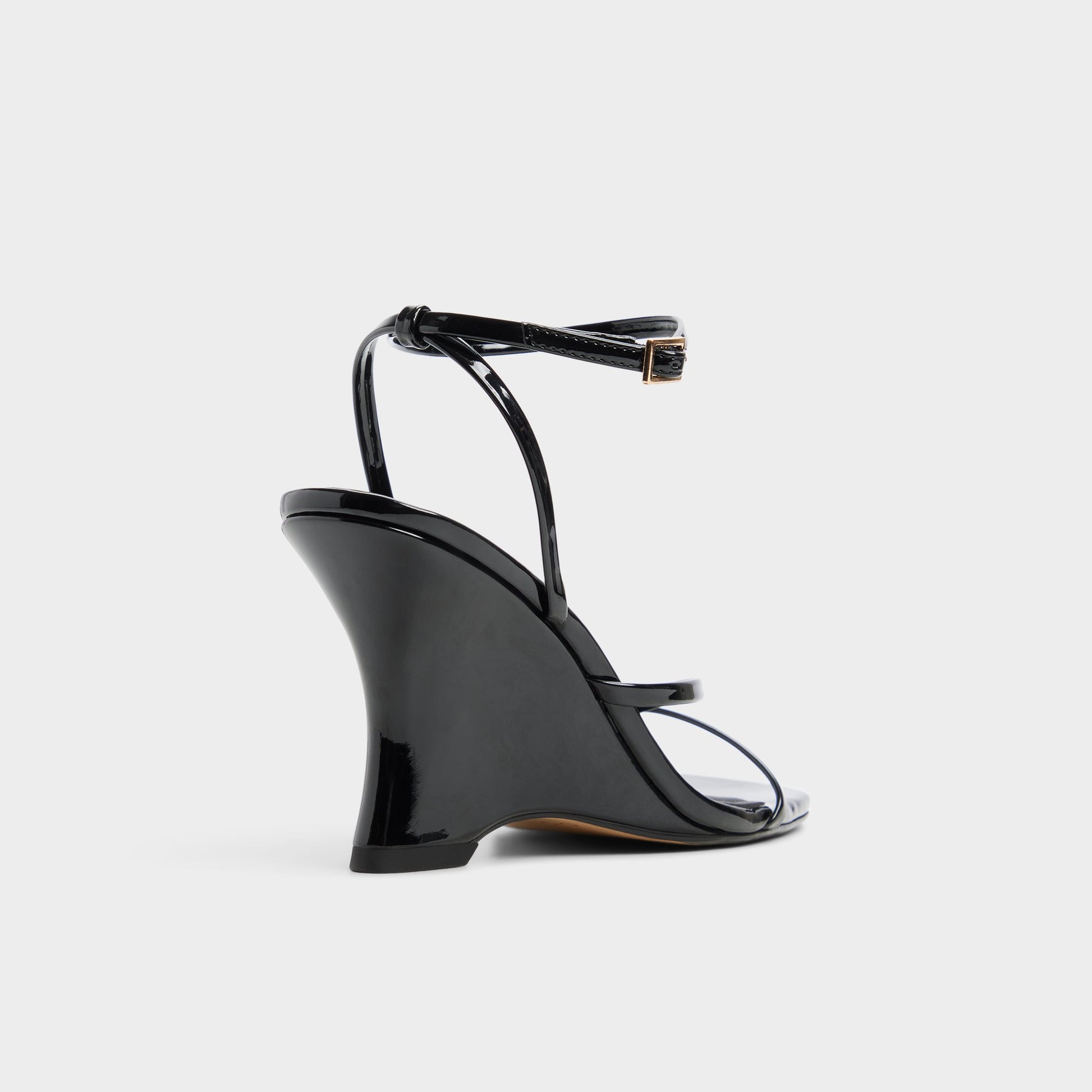 Three-quarter angle of Black Lexina Strappy heeled sandal's back side