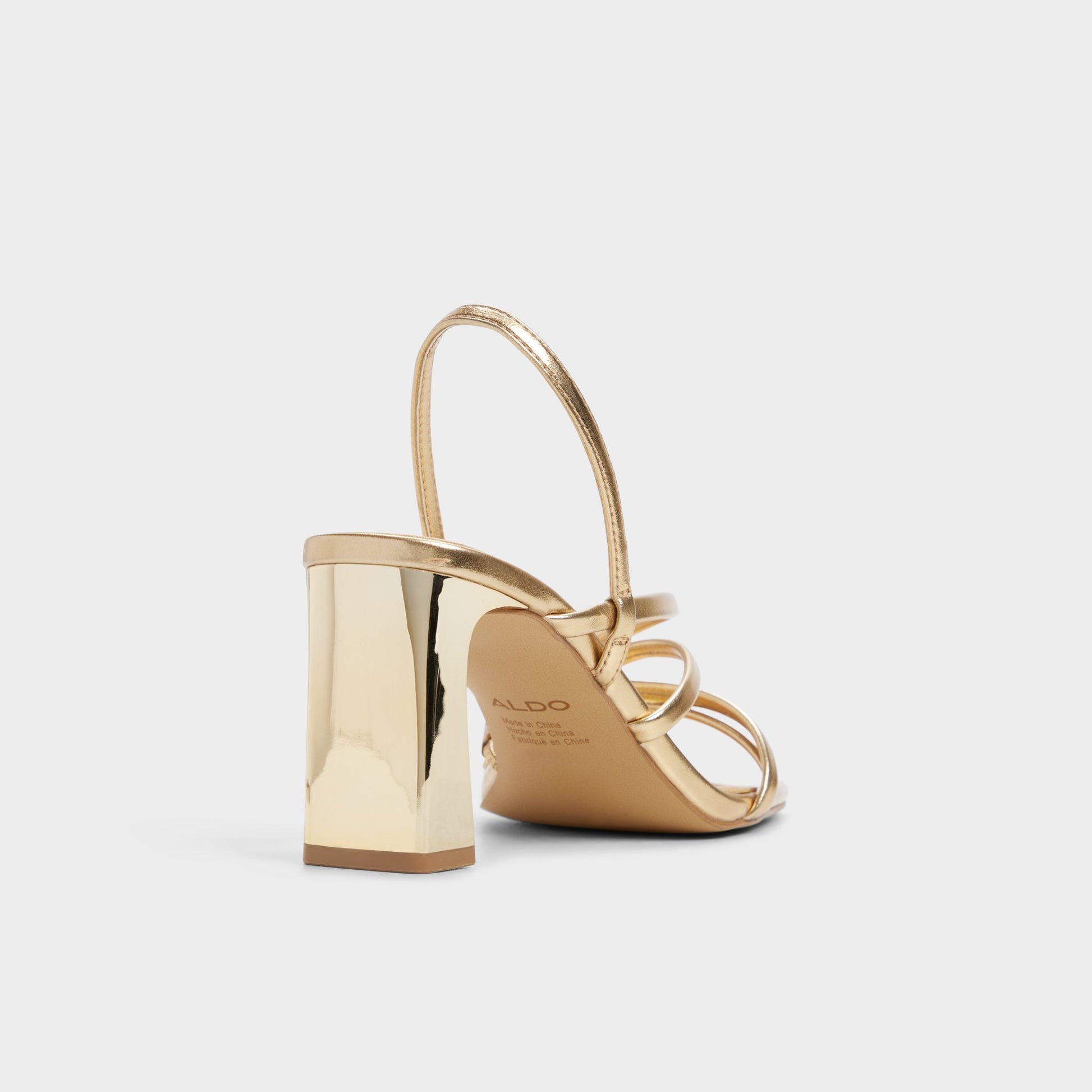 Three-quarter angle of Gold Sonali Strappy heeled sandal's back side