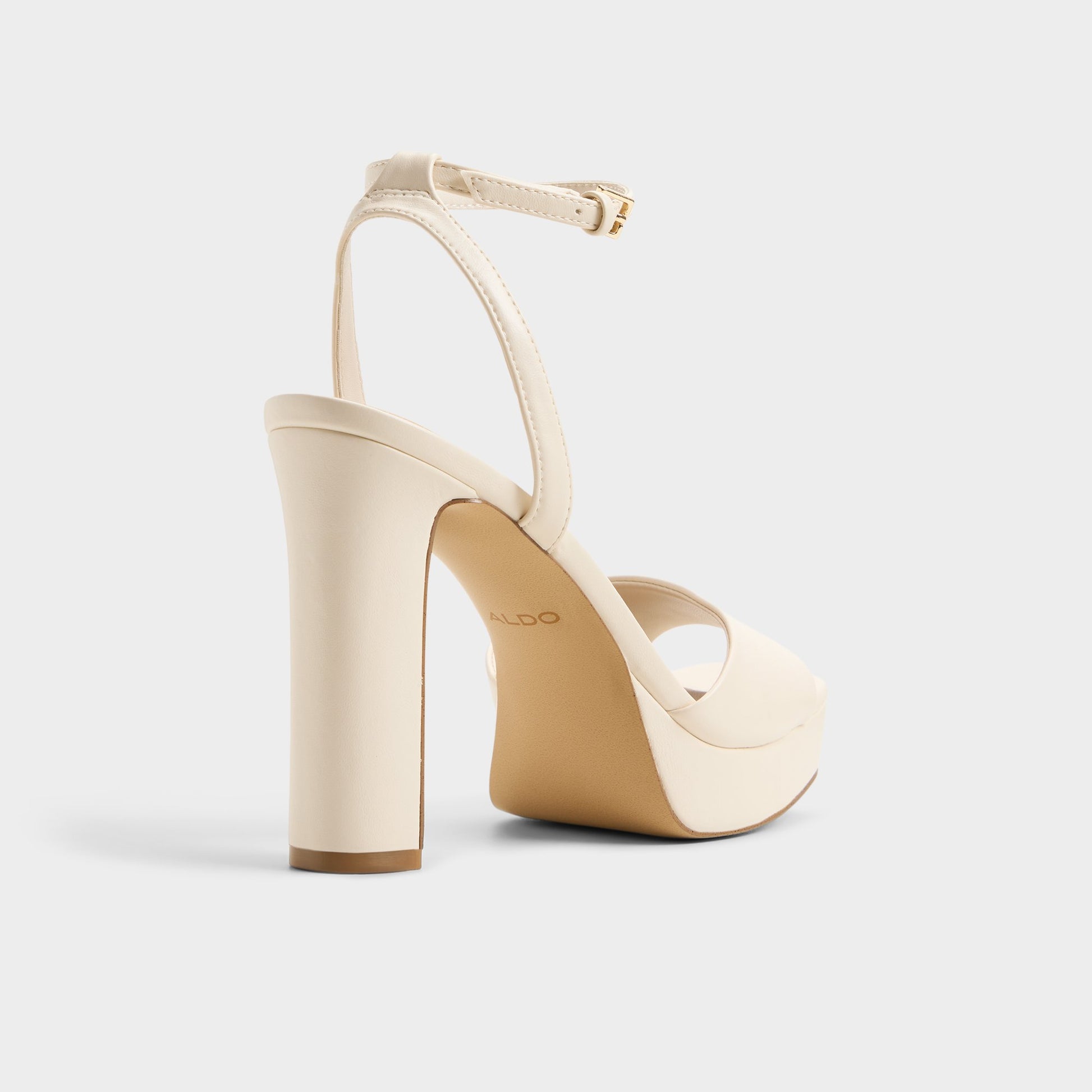 Three-quarter angle of White/bone Chicgleam Strappy heeled sandal's back side