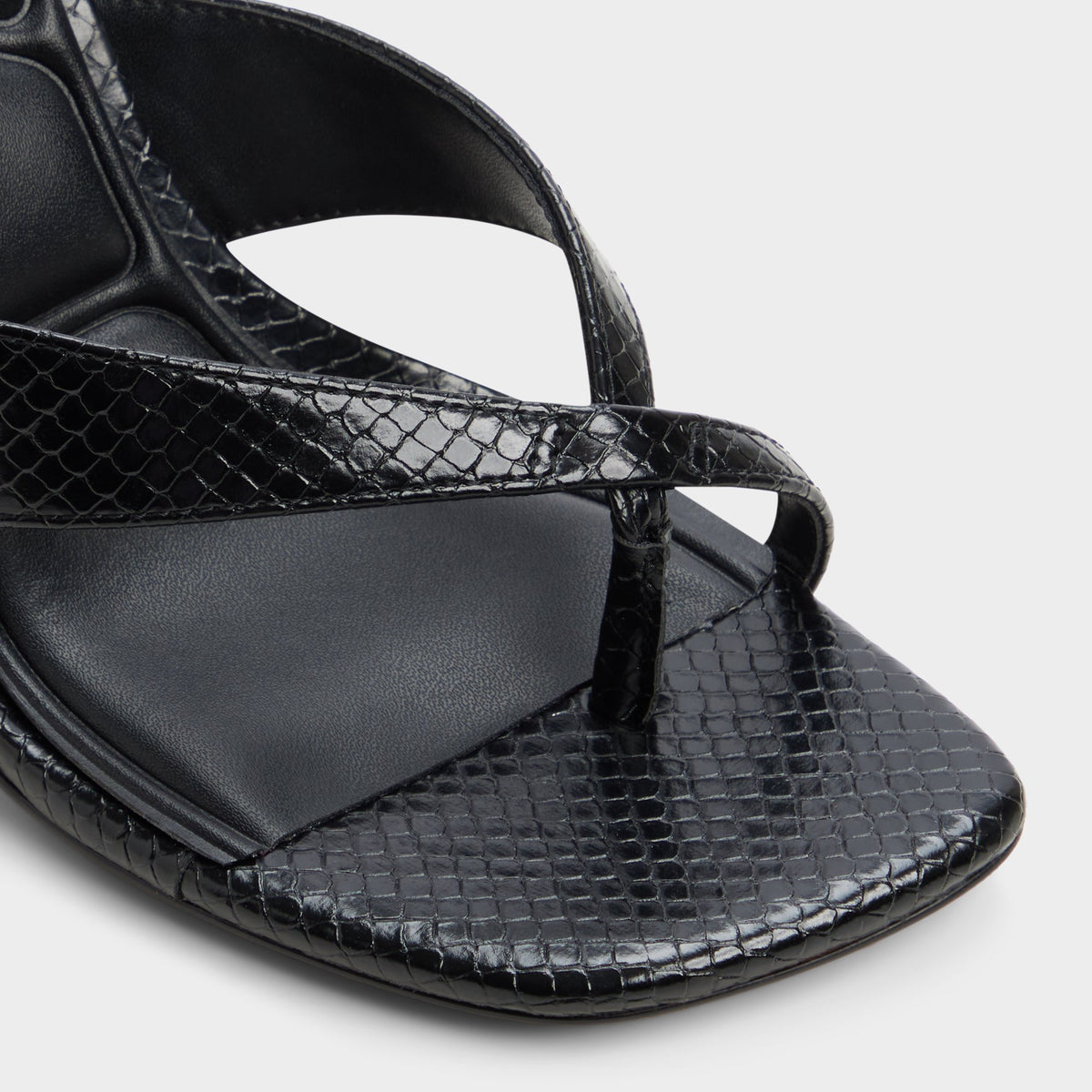 Close-up of the Black Haayssie Heeled flip flop