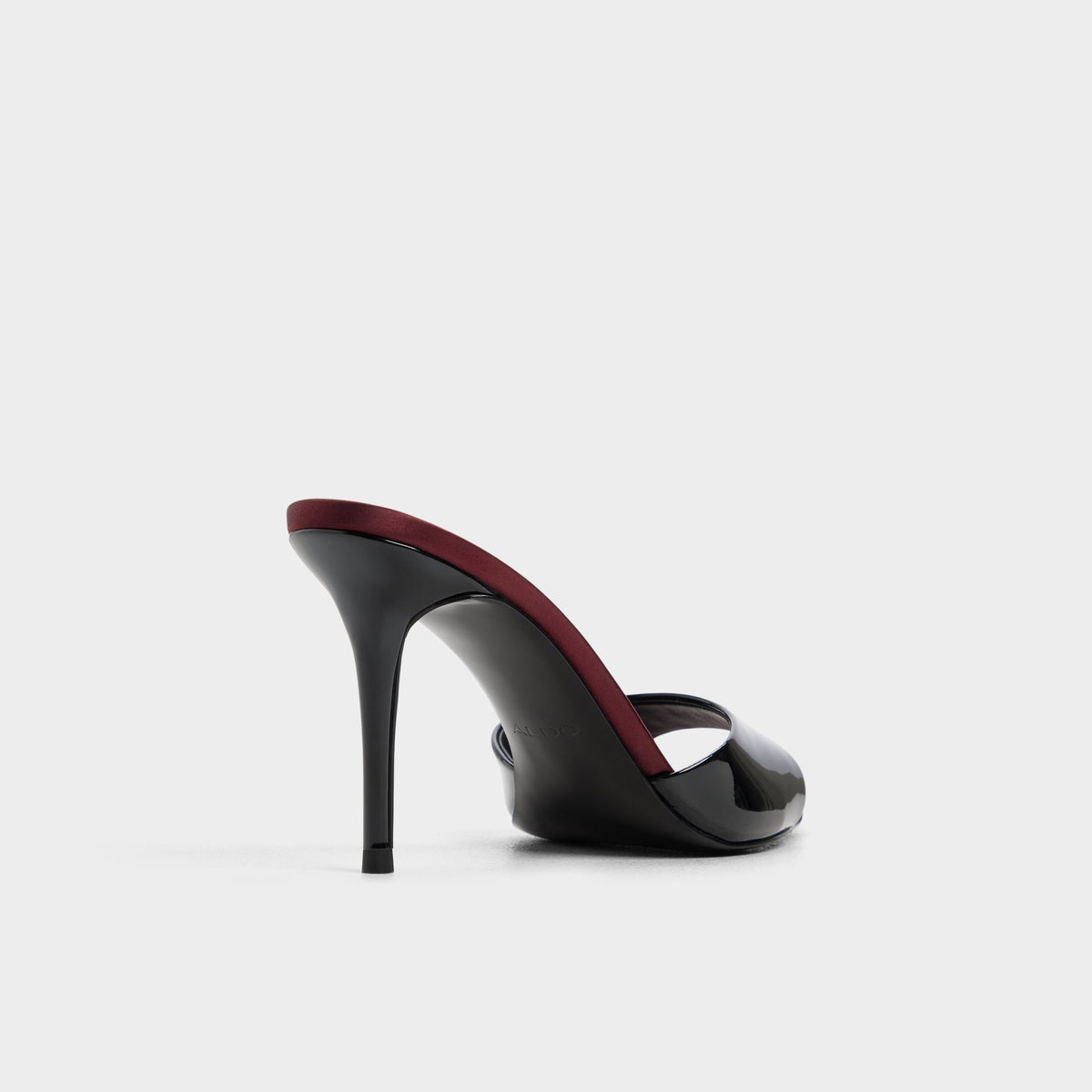 Three-quarter angle of Black combo Reanna Heeled mule's back side